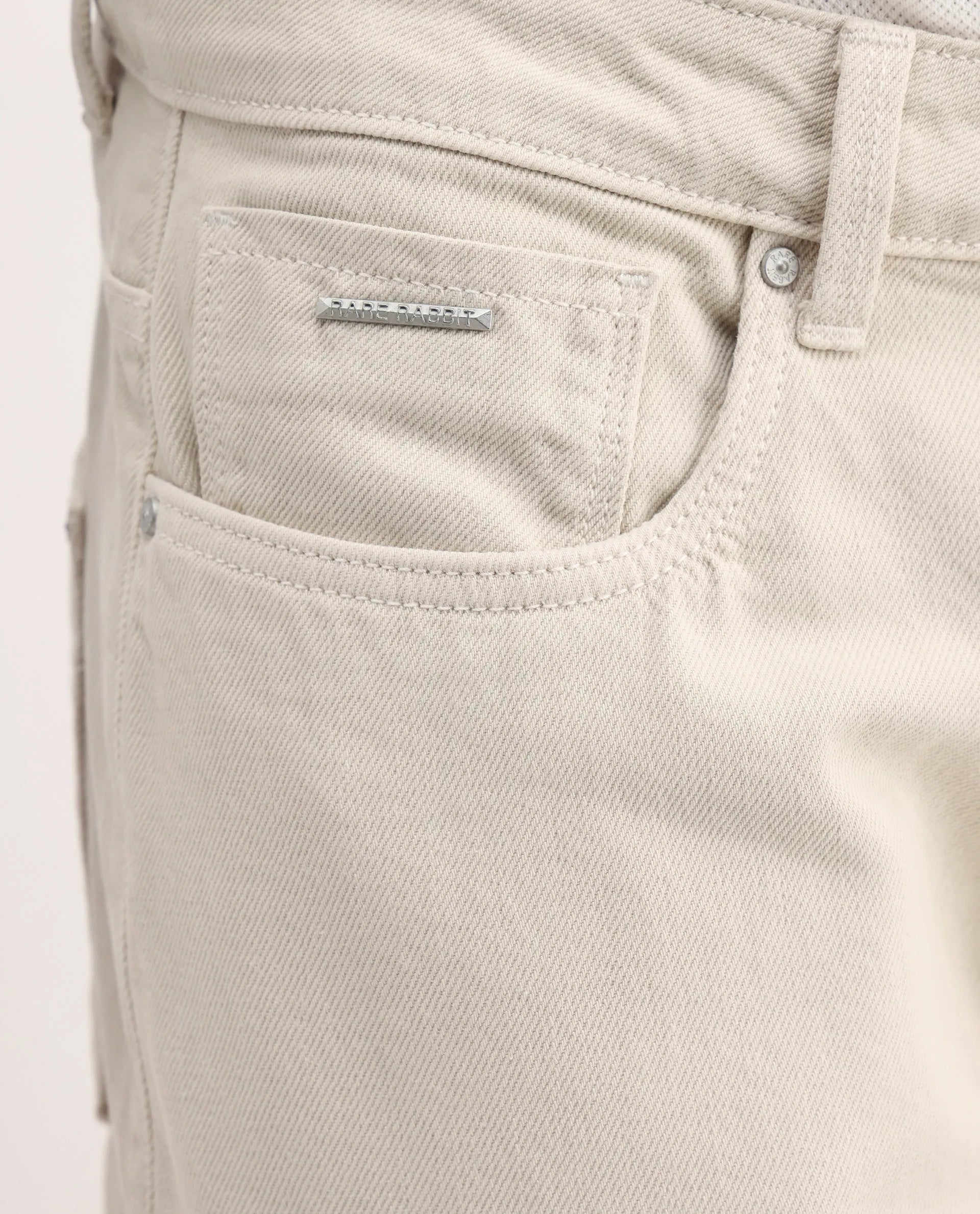 Rare Rabbit Men's Arvi-2 Light Beige Cotton Blend Plain Dond Carrot Fit Jeans