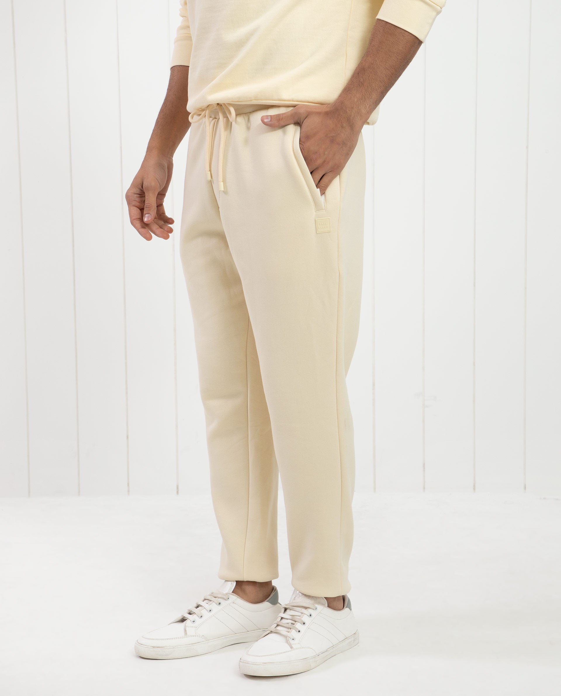 Rare Rabbit Mens Bard Light Yellow Cotton Polyester Fabric Drawstring Closure Regular Fit Mid Rise Trackpant