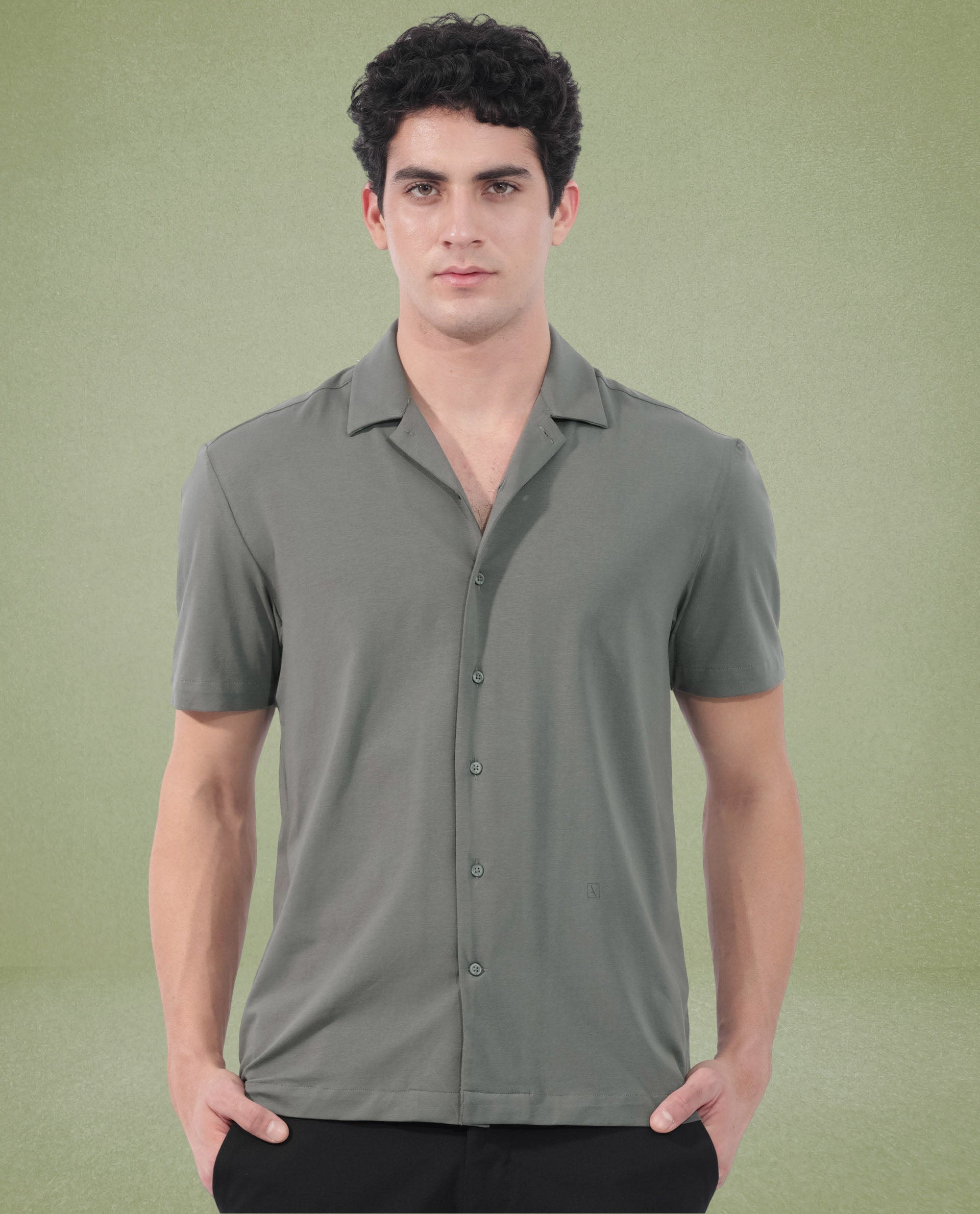 Rare Rabbit Men's Nick Dark Green Cotton Lycra Fabric Cuban Collar Half Sleeves Solid Shirt