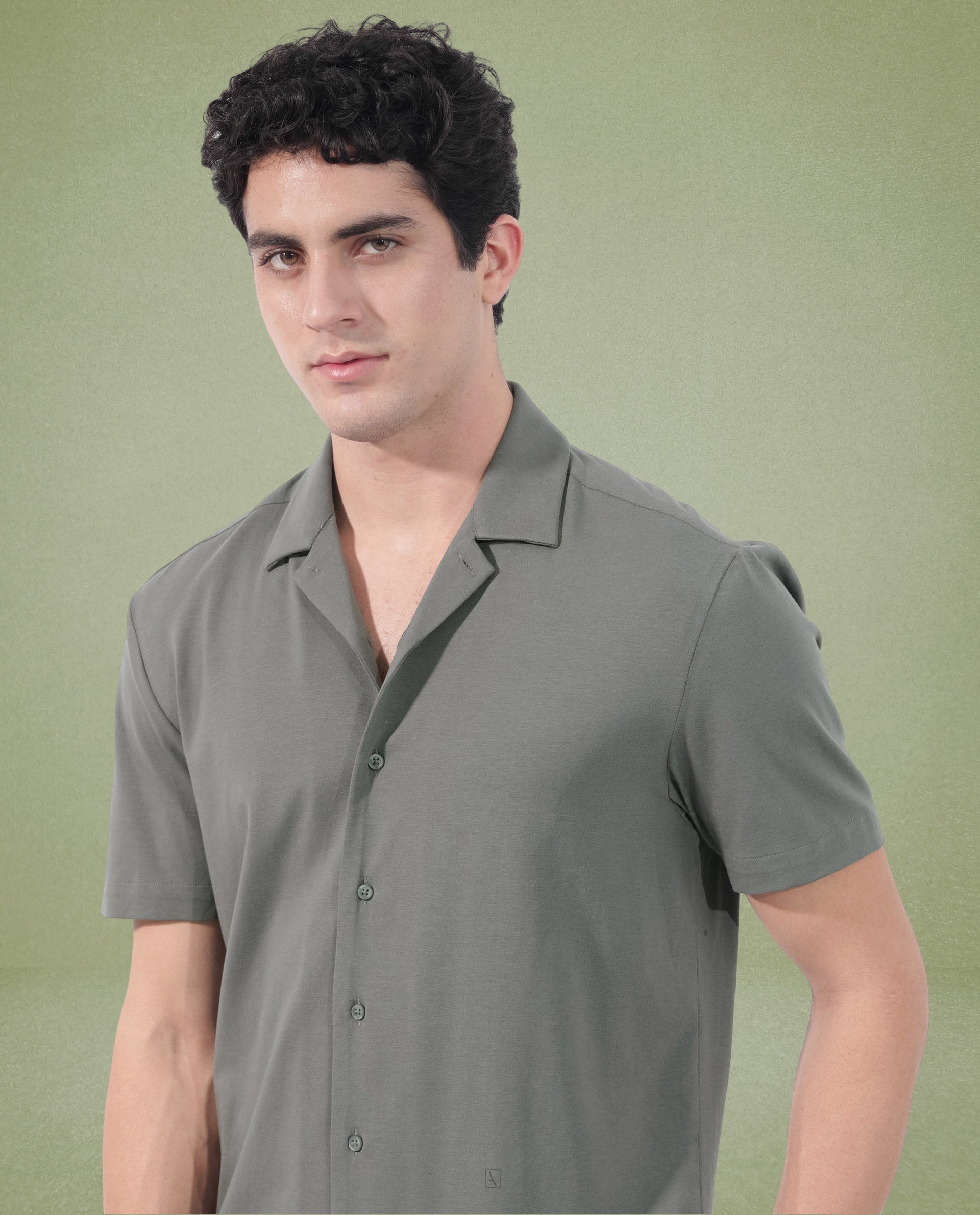 Rare Rabbit Men's Nick Dark Green Cotton Lycra Fabric Cuban Collar Half Sleeves Solid Shirt