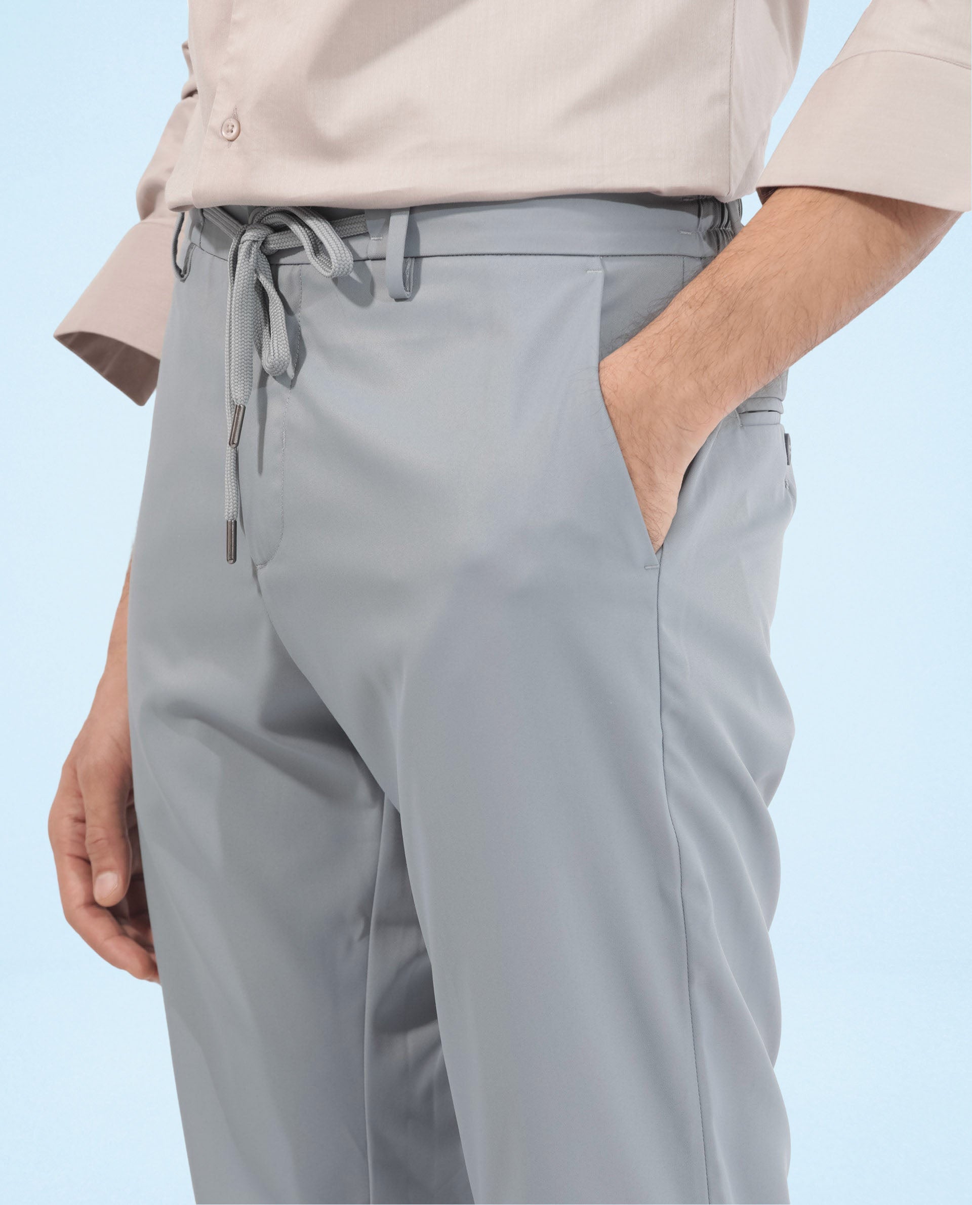 Rare Rabbit Men's Nimb Dusky Blue Polyester Fabric Drawstring And Button Closure High Rise Regular Fit Solid Trousers