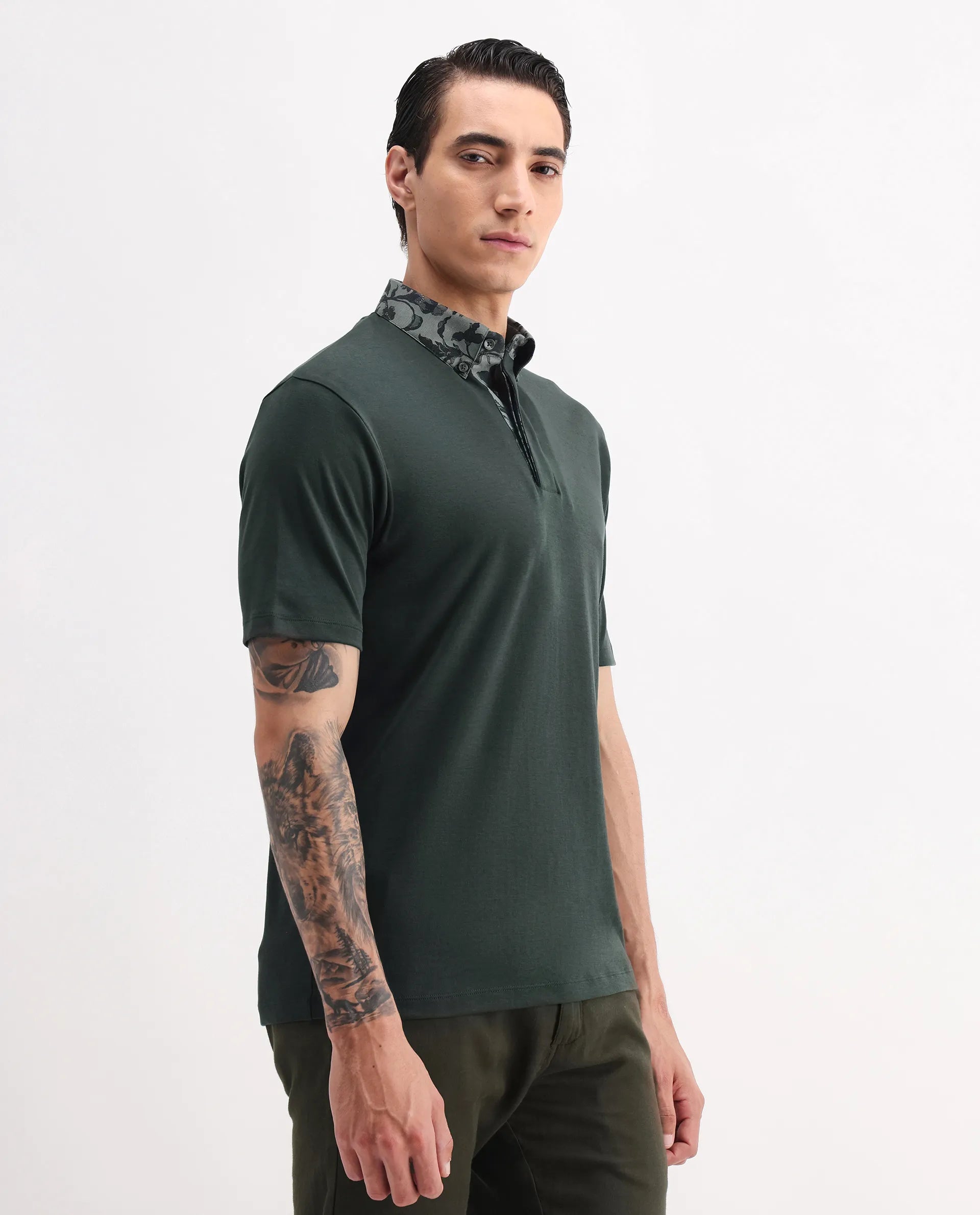 Rare Rabbit Men's Ringer-A25 Dark Green Cotton Plain Regular Fit Half Sleeve Polo