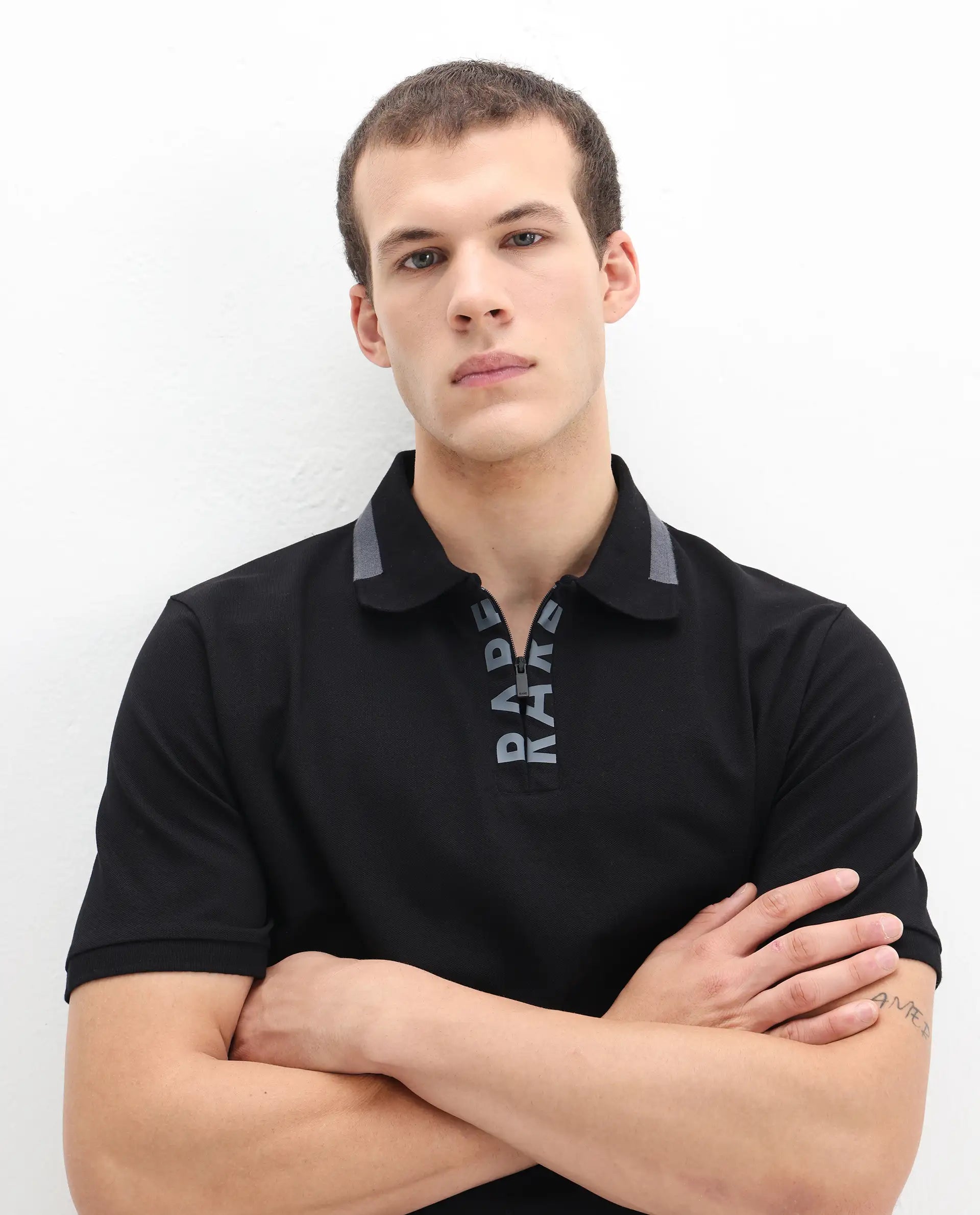 Rare Rabbit Men's Rique Black Cotton Plain Regular Fit Half Sleeve Polo
