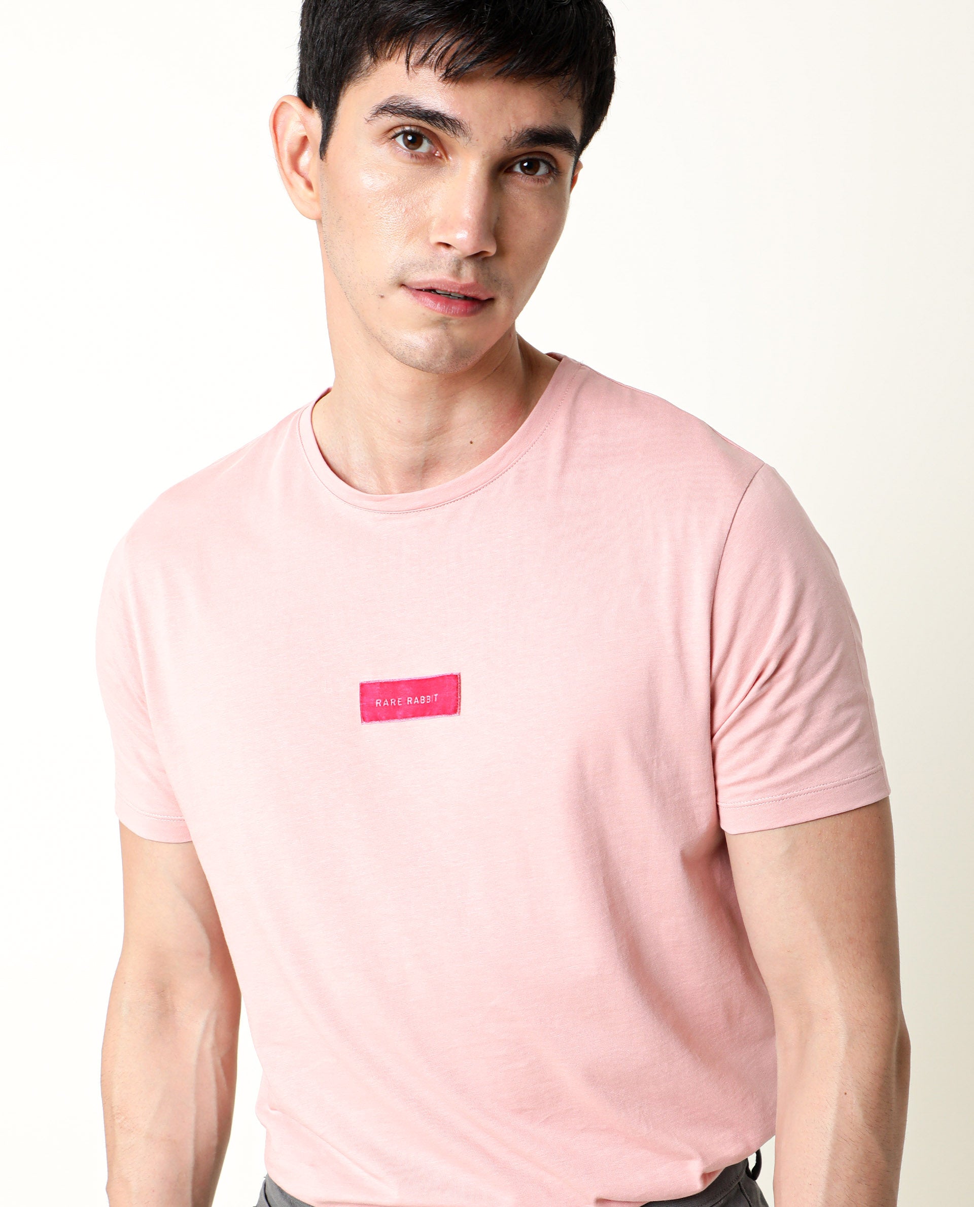 Rare Rabbit Men's Trix Peach Cotton Fabric Crew Neck Half Sleeves Slim Fit Velvet Badge Solid T-Shirt