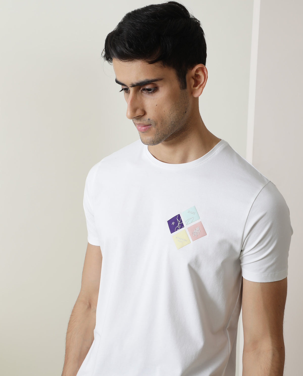 Rare Rabbit Men's Badget White Cotton Lycra Fabric Crew Neck Half Sleeves Regular Fit Graphic Print Branding T-Shirt