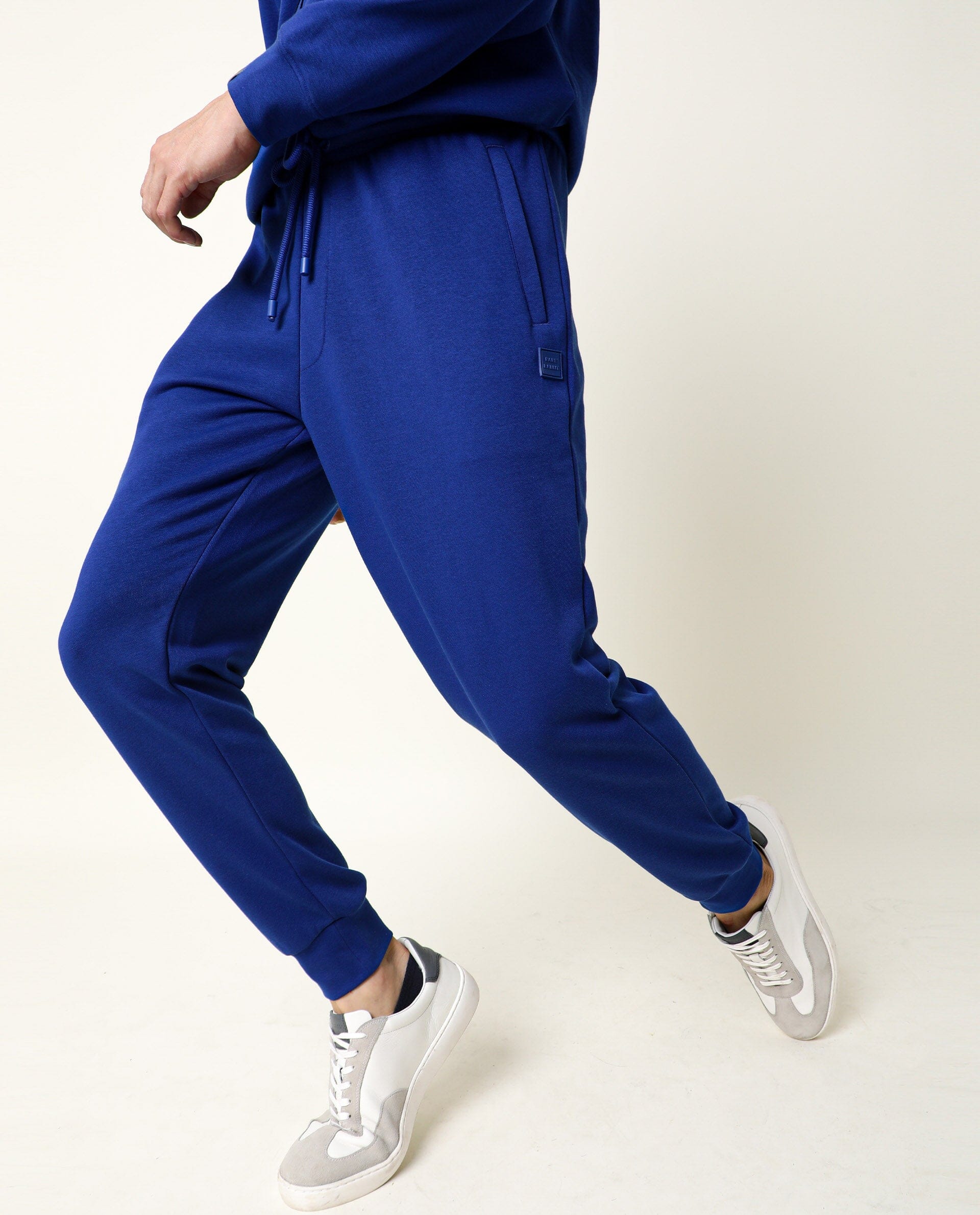 Rare Rabbit Men's Titan Fluorescent Blue Cotton Polyester Fabric Drawstring Slim Fit Track Pant