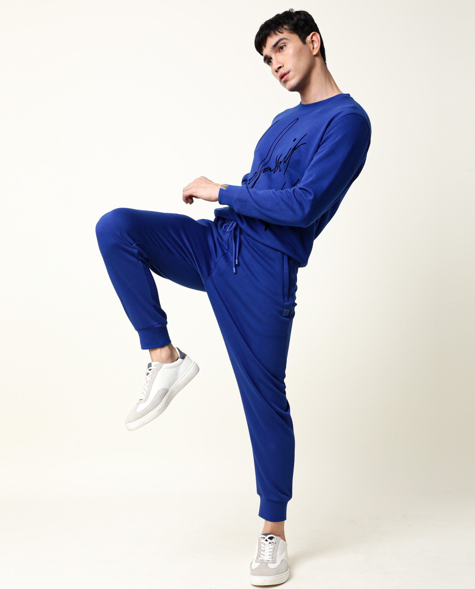 Rare Rabbit Men's Titan Fluorescent Blue Cotton Polyester Fabric Drawstring Slim Fit Track Pant