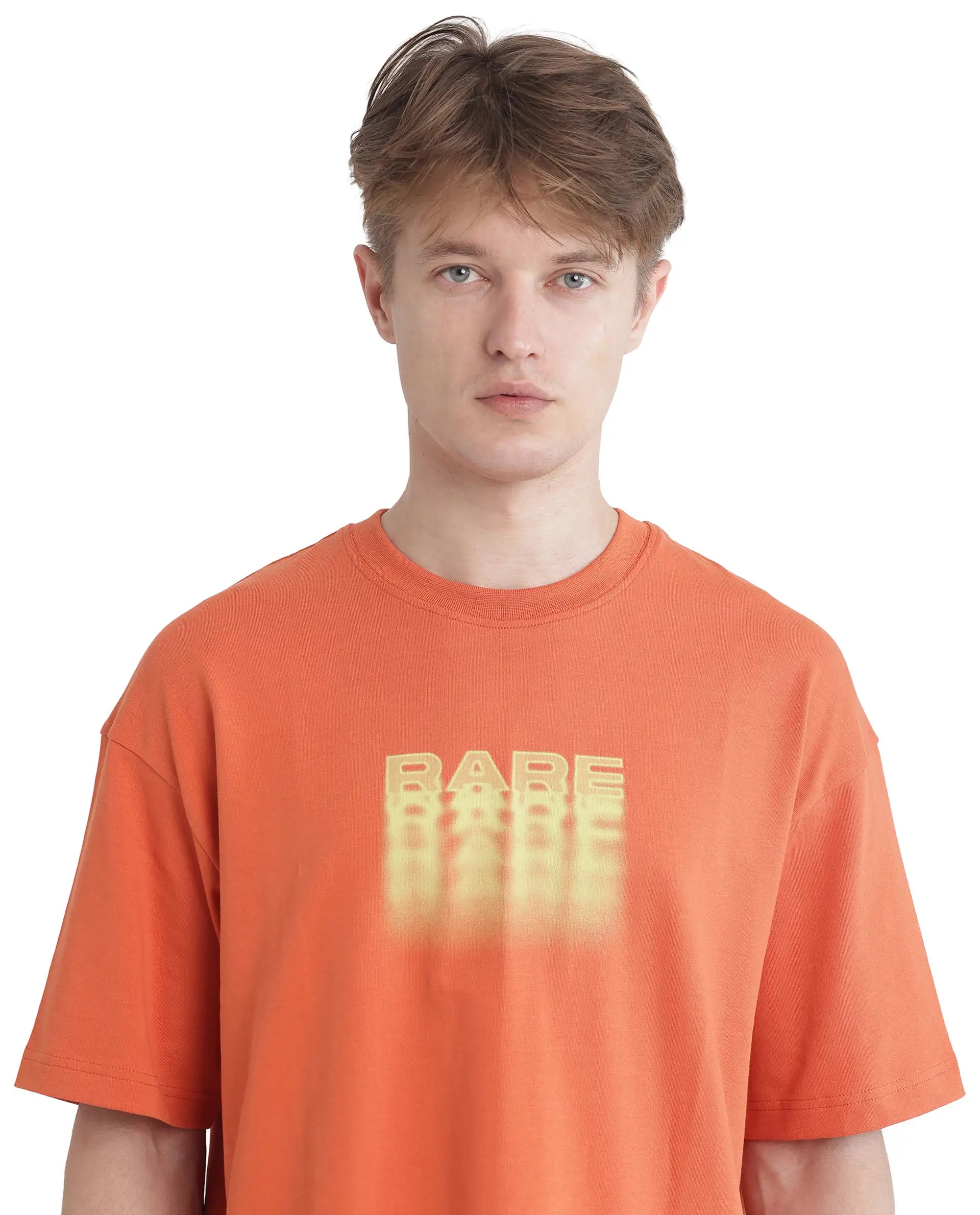 Rare Rabbit Men Act Orange Cotton Fabric Short Sleeve Crew Neck Slip-On Oversized Fit Graphic Print T-Shirt