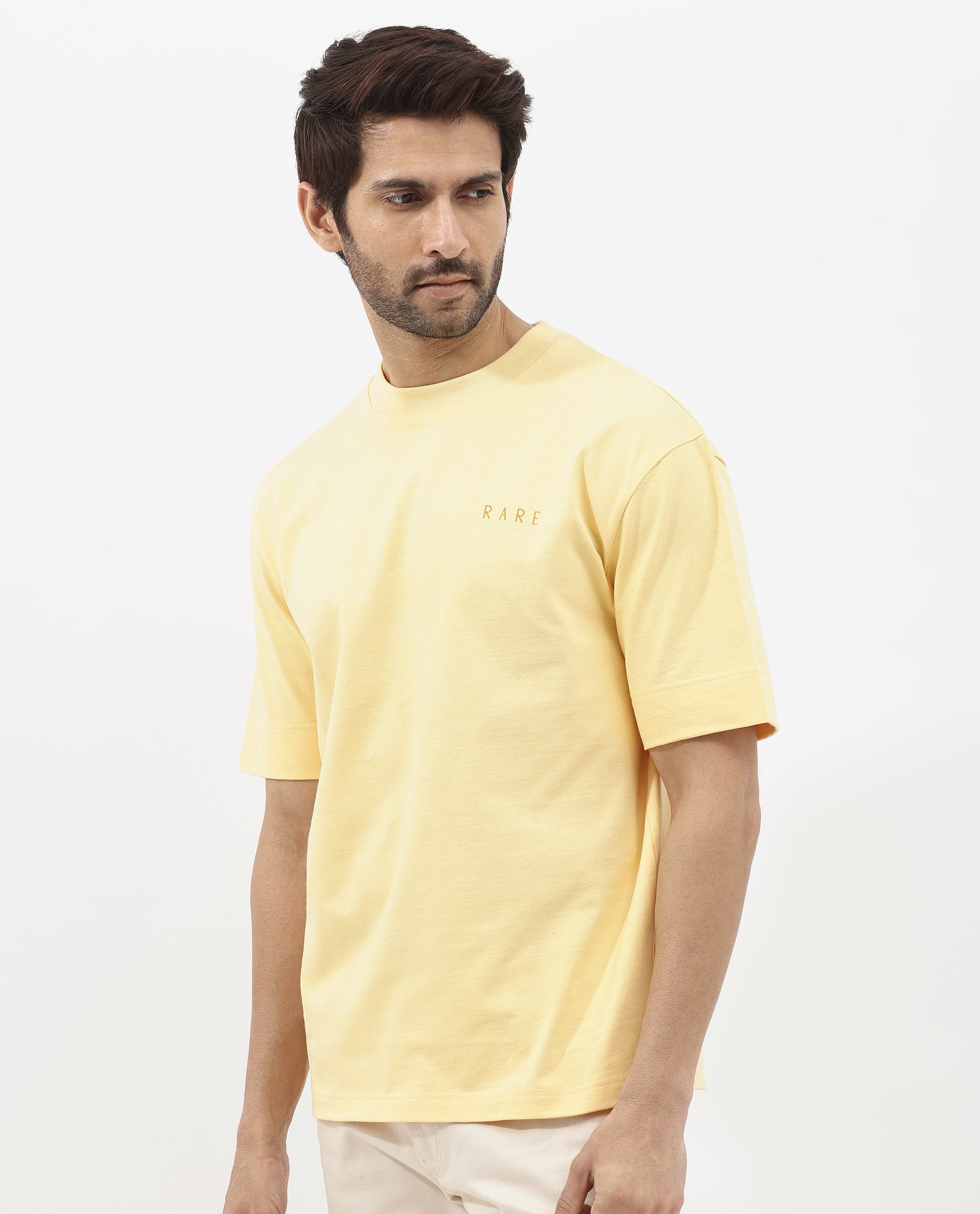 Rare Rabbit Articale Mens Beck Dusky Yellow Cotton Fabric Short Sleeve Crew Neck Oversized Fit Graphic Printed T-Shirt