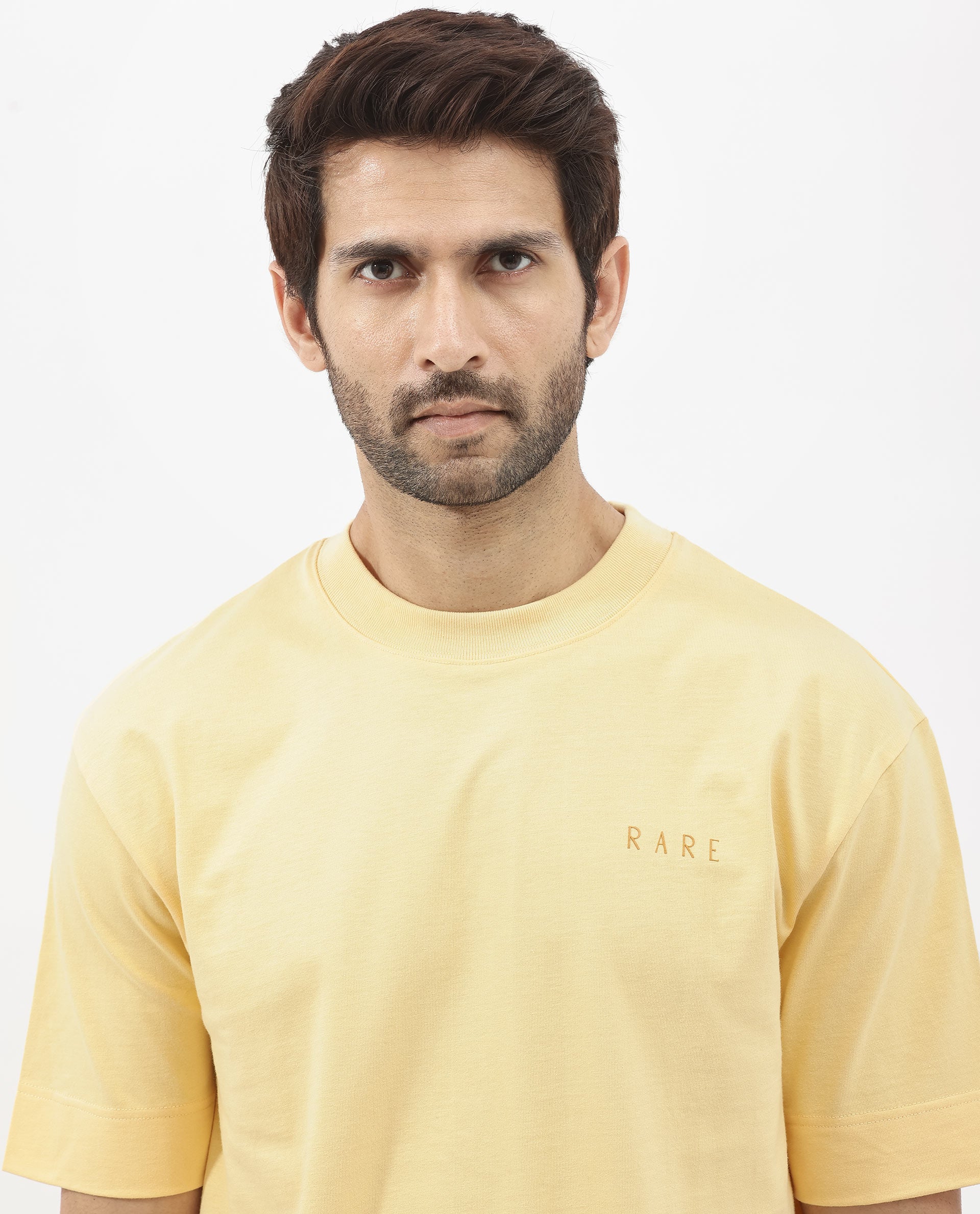 Rare Rabbit Articale Mens Beck Dusky Yellow Cotton Fabric Short Sleeve Crew Neck Oversized Fit Graphic Printed T-Shirt