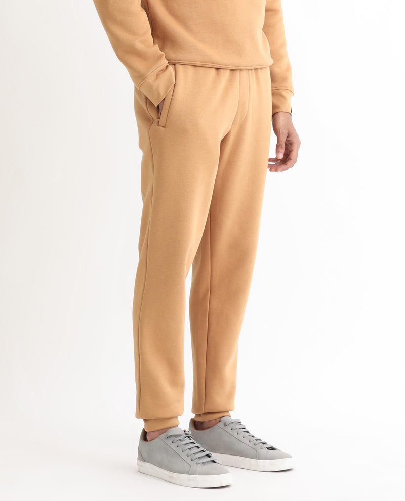 RARE RABBIT MENS BRIGHTON MUSTARD TRACK PANT COTTON POLYESTER FABRIC MID RISE KNITTED DRAW STRING CLOSURE REGULAR FIT