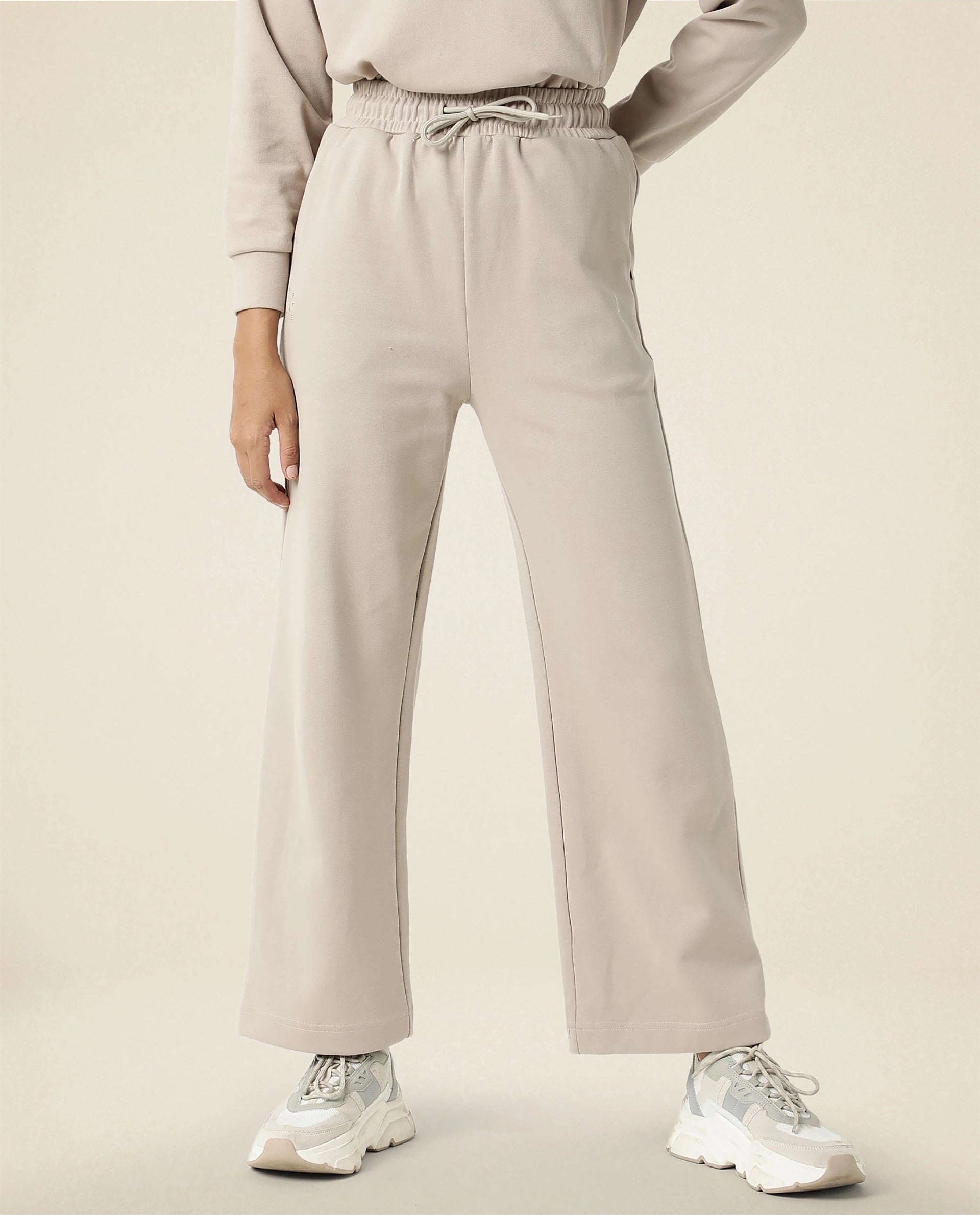 Rareism Women Capsule Beige Cotton Blend Fabric Relaxed Fit Solid Mid Rise Ankle Length Track Pant