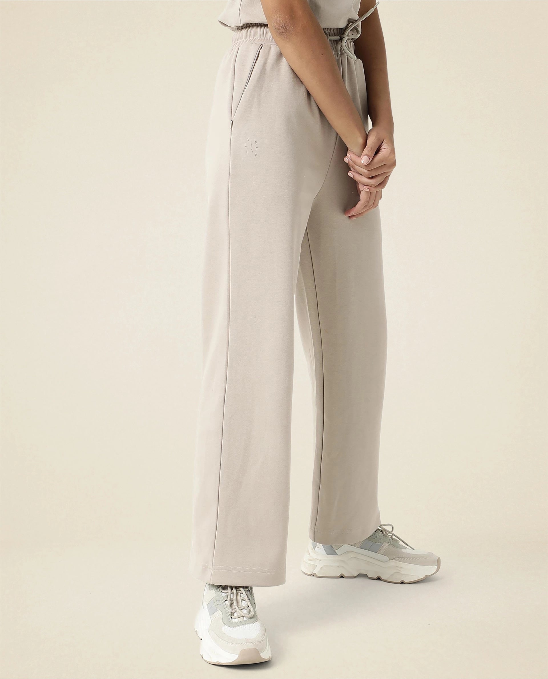 Rareism Women Capsule Beige Cotton Blend Fabric Relaxed Fit Solid Mid Rise Ankle Length Track Pant