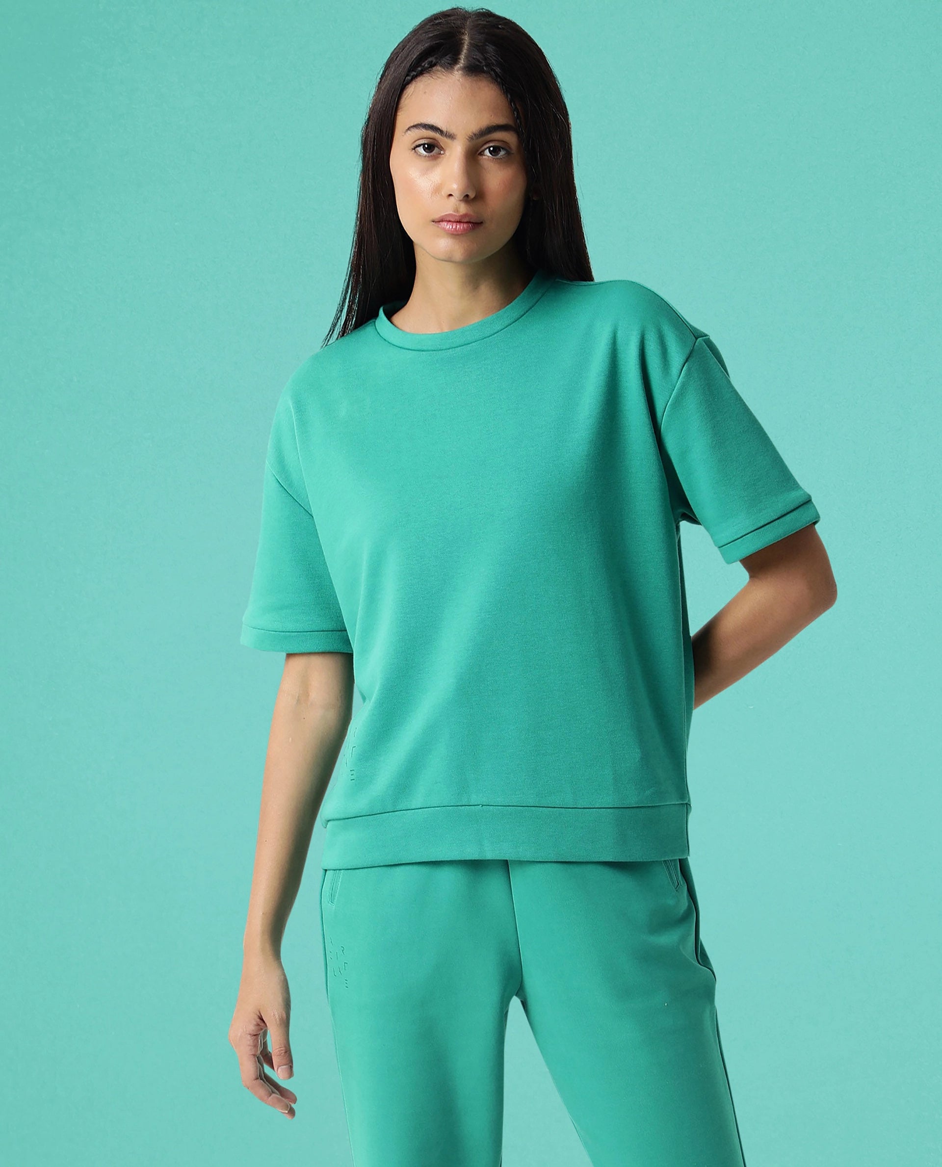 Rareism Women Coco Green Cotton Fabric Half Sleeves Relaxed Fit Solid Round Neck Sweat Tee