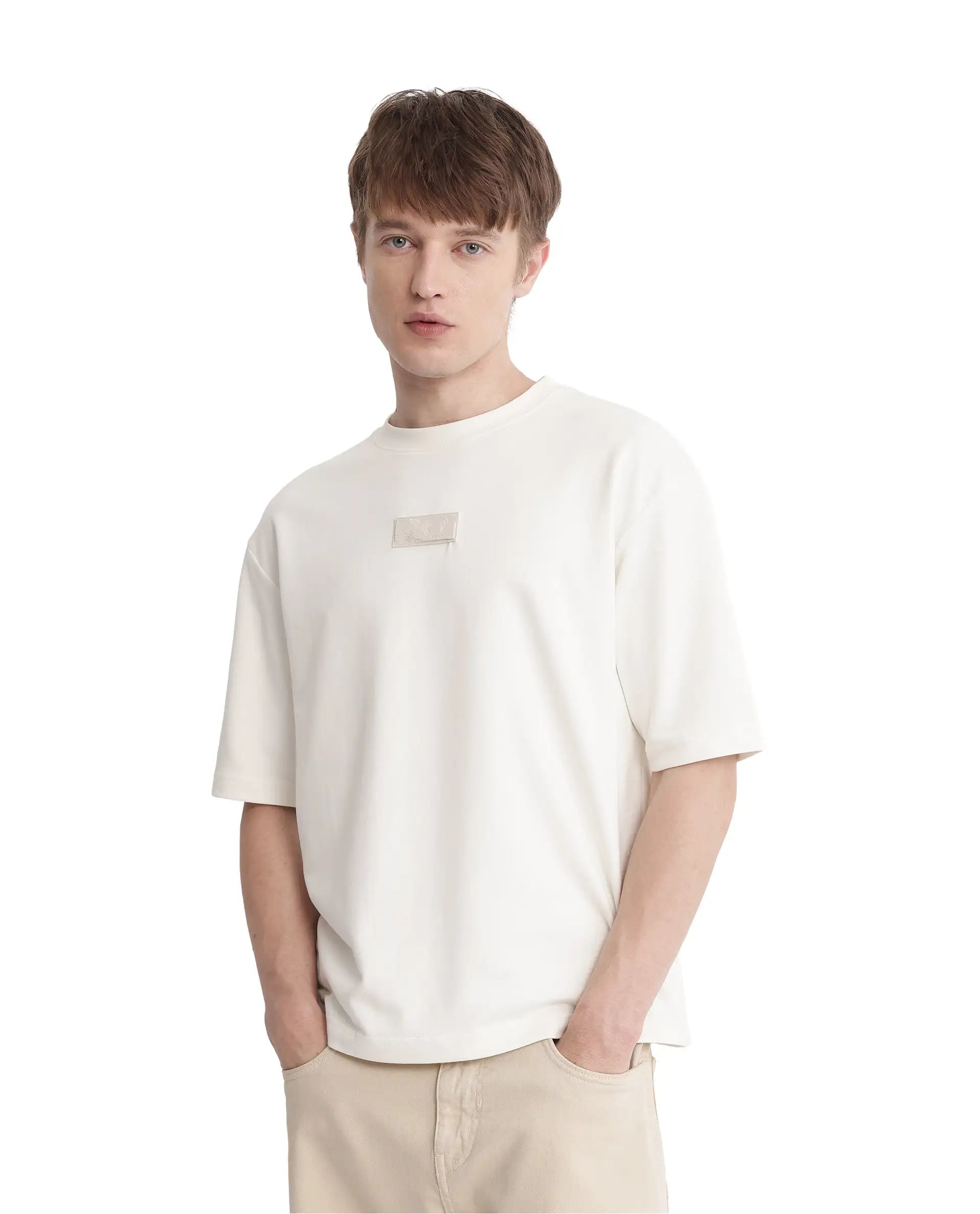 Rare Rabbit Men Endy Off White Cotton Poly Fabric Short Sleeve Boxy Fit Silicone Badge Branding T-Shirt