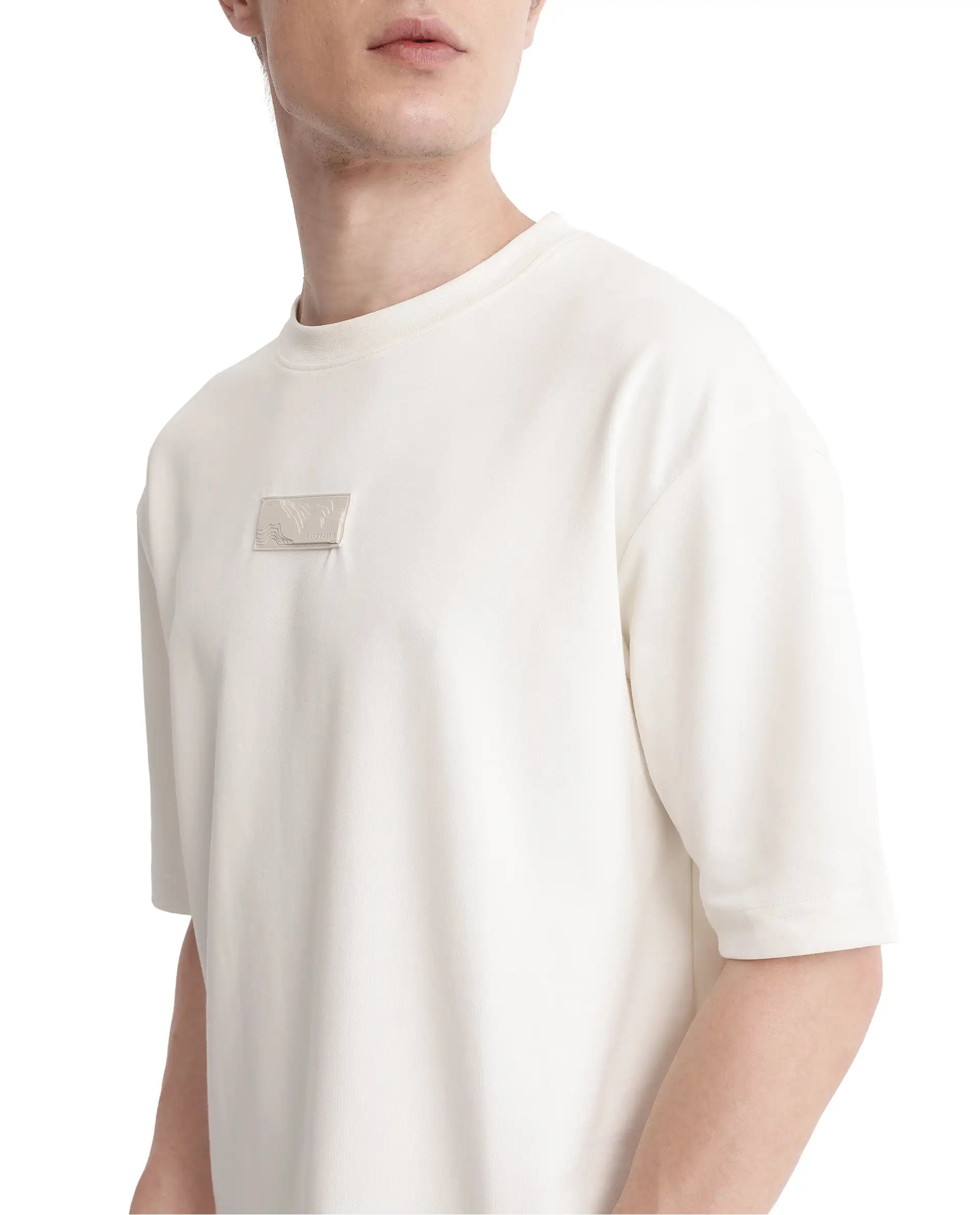 Rare Rabbit Men Endy Off White Cotton Poly Fabric Short Sleeve Boxy Fit Silicone Badge Branding T-Shirt