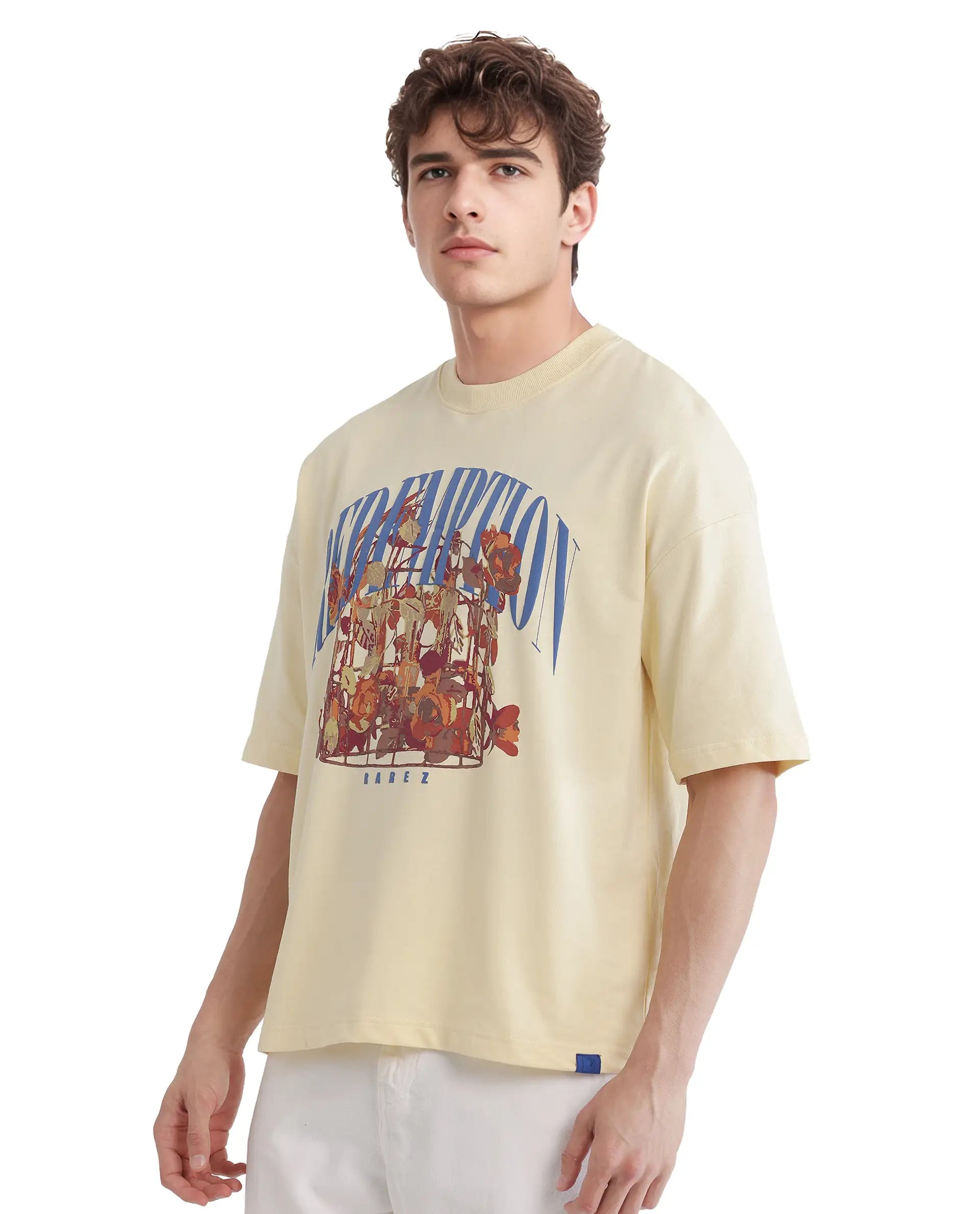 Rare Rabbit Men Fler Pastel Yellow Cotton Fabric Short Sleeve Crew Neck Oversized Fit Hd and Typography Print T-Shirt