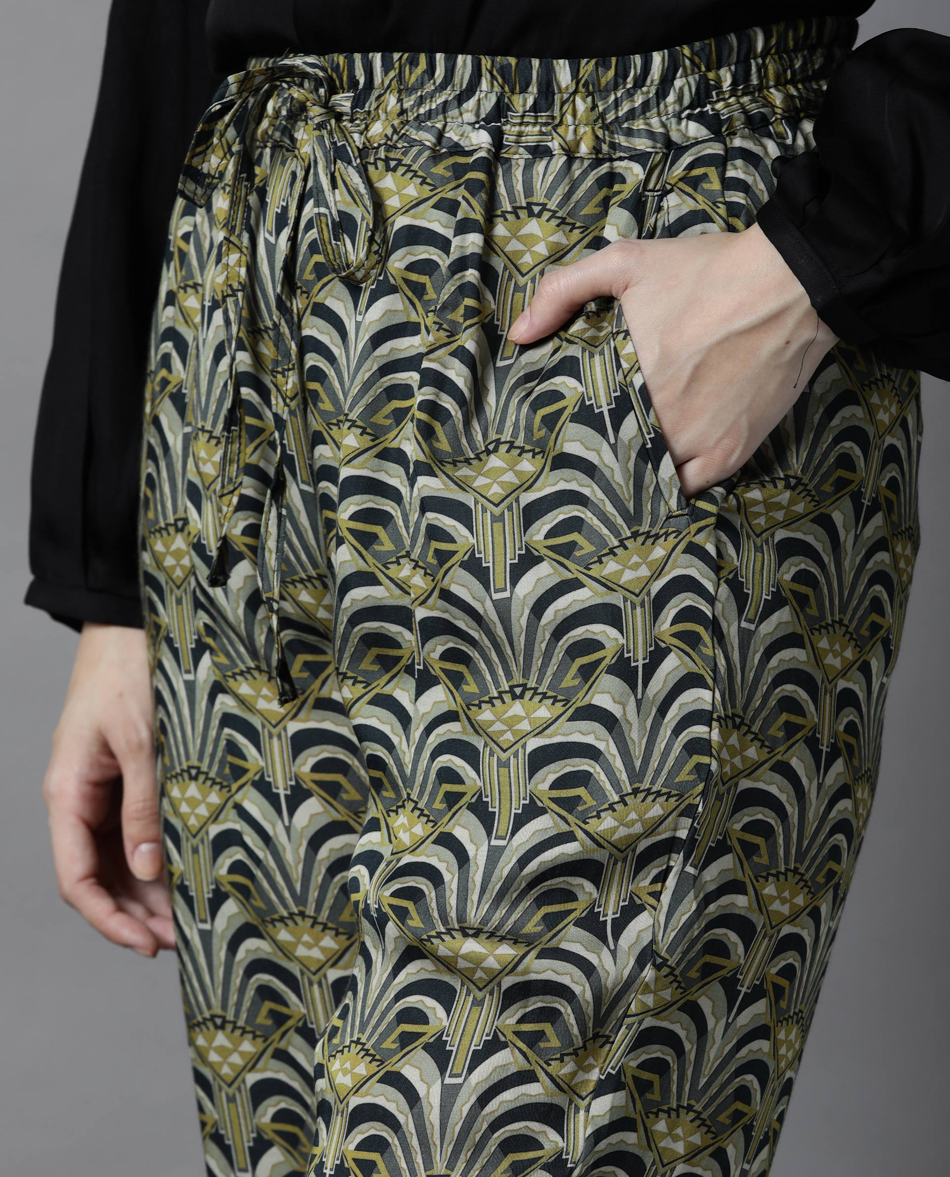 Rareism Women Globe Green Modal Fabric Regular Fit Mid Rise Abstract Print Ankle Length Trousers