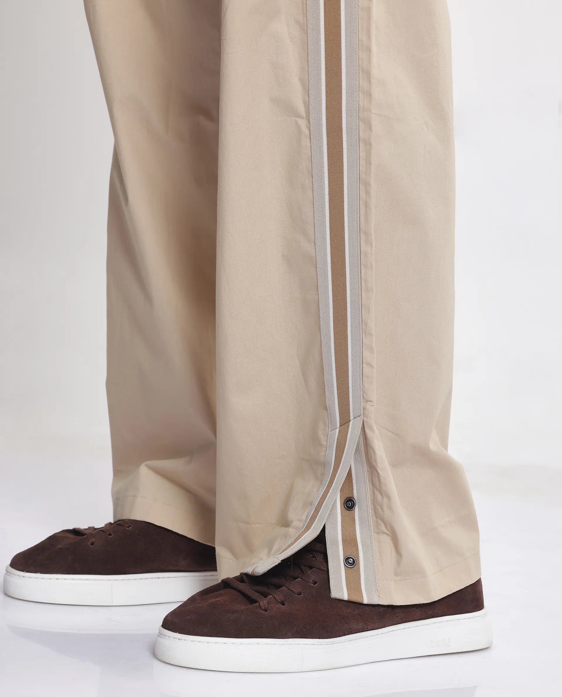 Rare Rabbit Men Macon Beige Cotton Fabric Tape Detailed Mid Rise Baggy Fit Track Pant