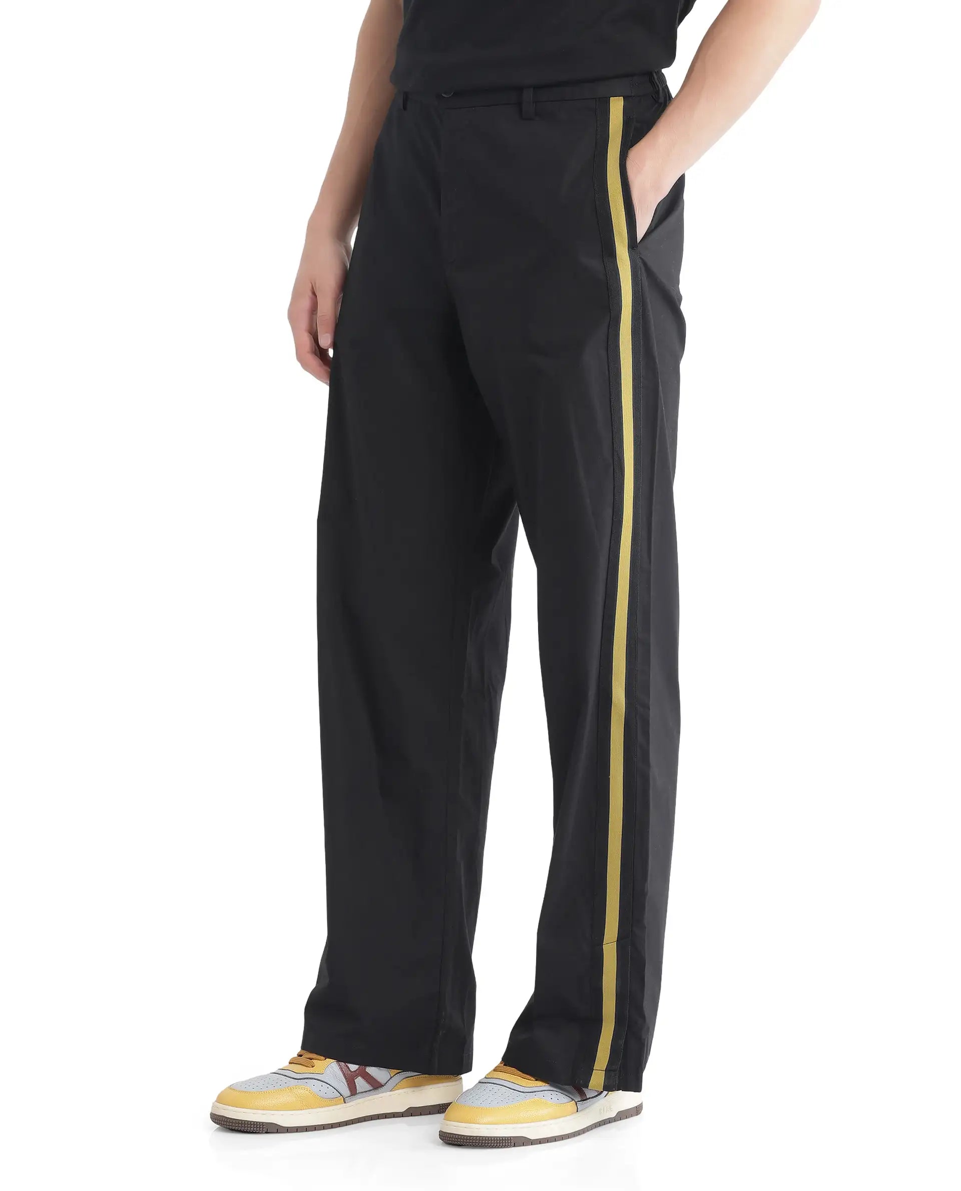 Rare Rabbit Men Newnon Black Cotton Fabric Mid Rise Baggy Fit Side Slit with Snap Button Closure Tape Detailing Track Pant