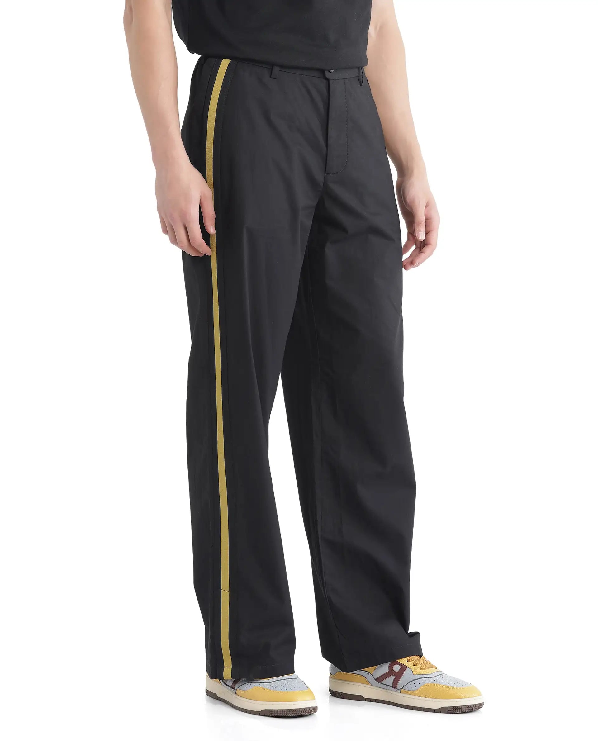 Rare Rabbit Men Newnon Black Cotton Fabric Mid Rise Baggy Fit Side Slit with Snap Button Closure Tape Detailing Track Pant