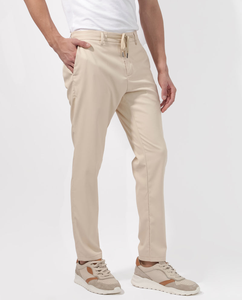 Rare Rabbit Men's Nimb Beige Polyester Fabric Drawstring And Button Closure High Rise Regular Fit Solid Trousers