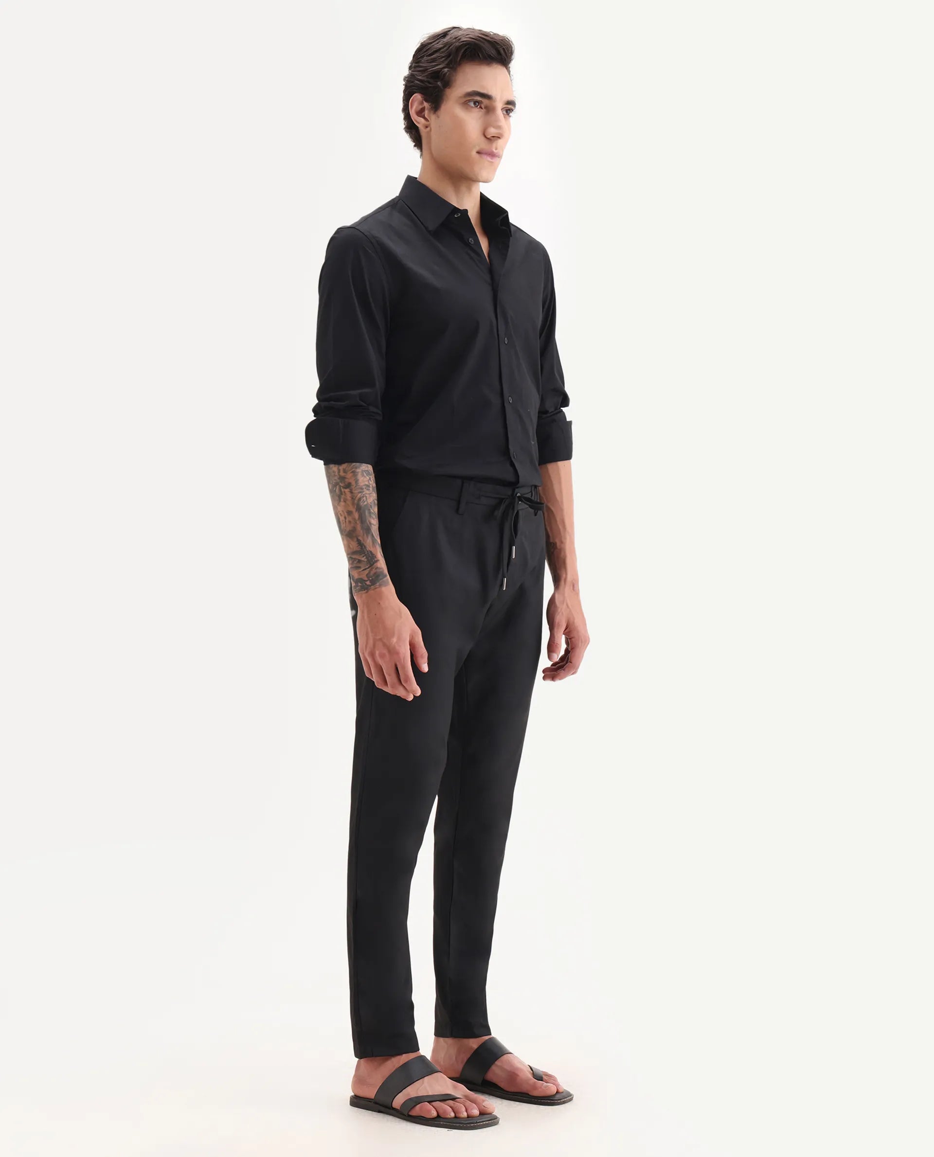 Rare Rabbit Men's Nimb Black Polyester Fabric Drawstring And Button Closure High Rise Regular Fit Solid Trousers