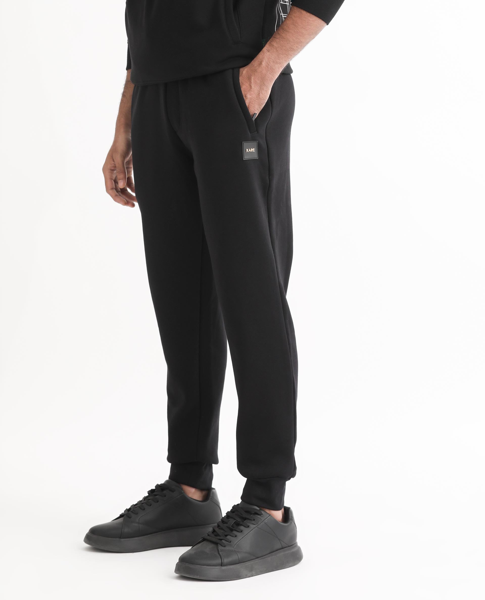 Black Solid Polyester Blend Mid Rise Track Pants (BOTAPE) | Celio