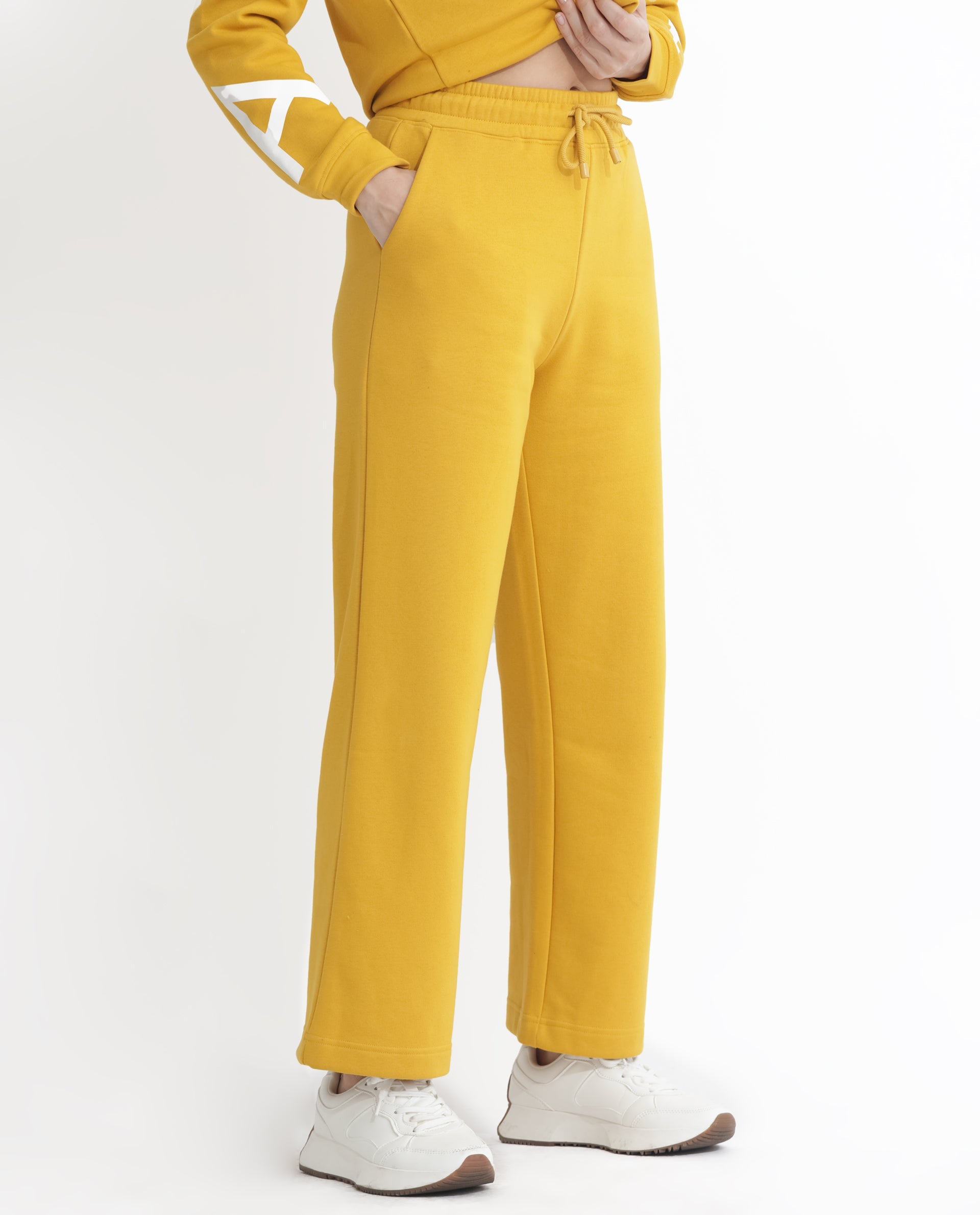 Rareism Women Pazoo F Mustard Cotton Blend Fabric Flared Solid Mid Rise Ankle Length Track Pant