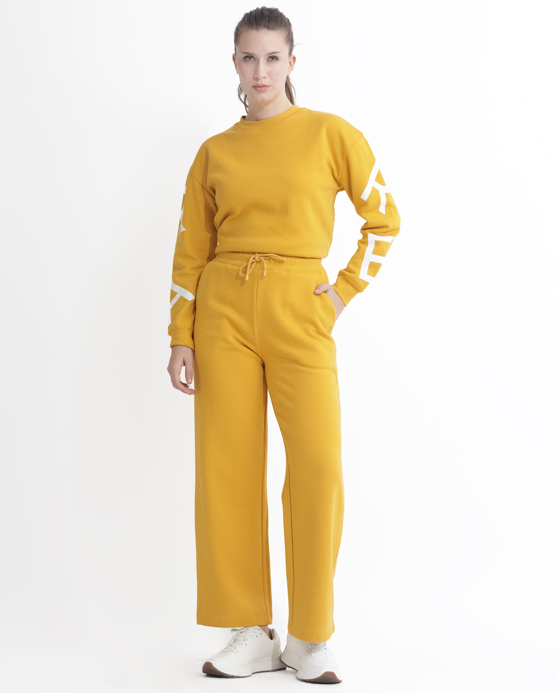 Rareism Women Pazoo F Mustard Cotton Blend Fabric Flared Solid Mid Rise Ankle Length Track Pant