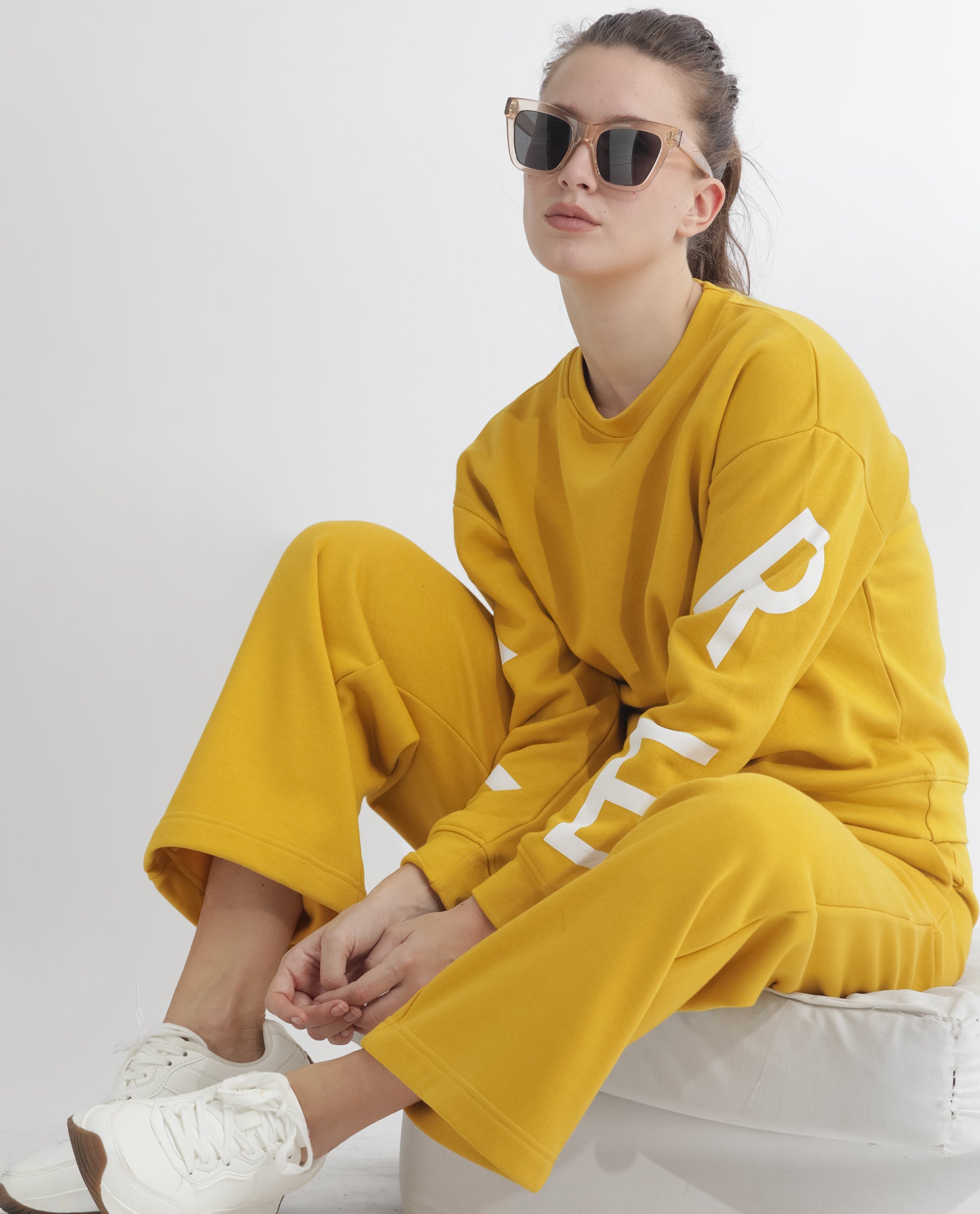 Rareism Women Pazoo F Mustard Cotton Blend Fabric Flared Solid Mid Rise Ankle Length Track Pant