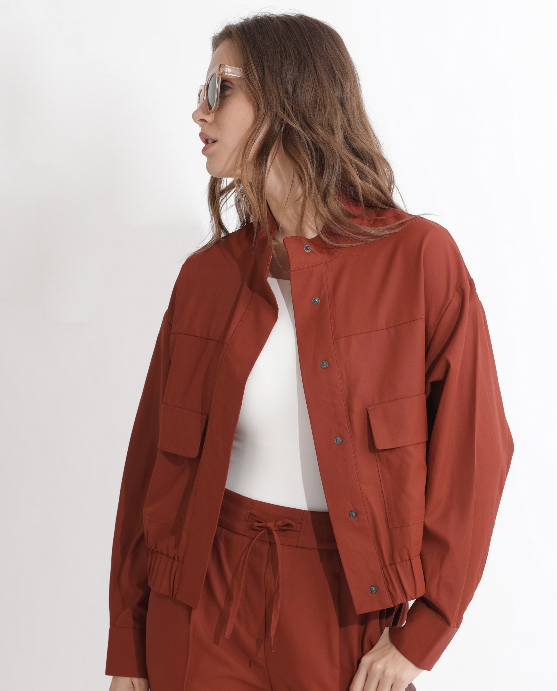 Rareism Articale Women Ruks Rust Polyester Fabric Full Sleeves Button Closure High Neck Regular Fit Plain Jacket