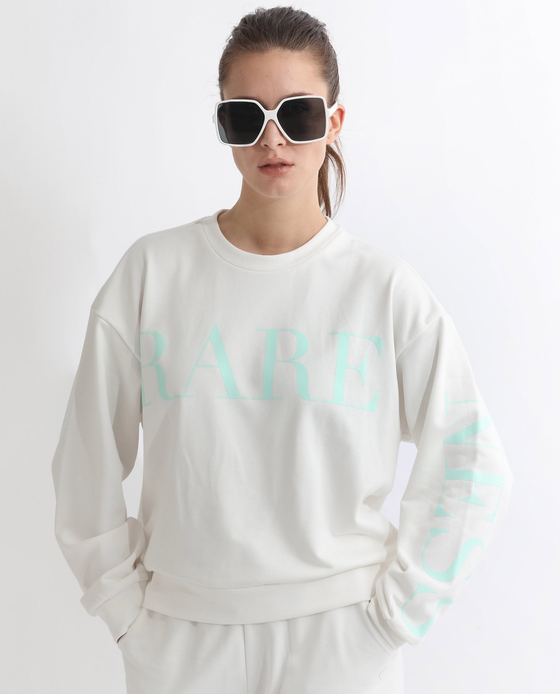 Rareism Articale Women Shelly Off White Poly Cotton Fabric Full Sleeves Cuffed Sleeve Round Neck Relaxed Fit Graphic Print Sweatshirt