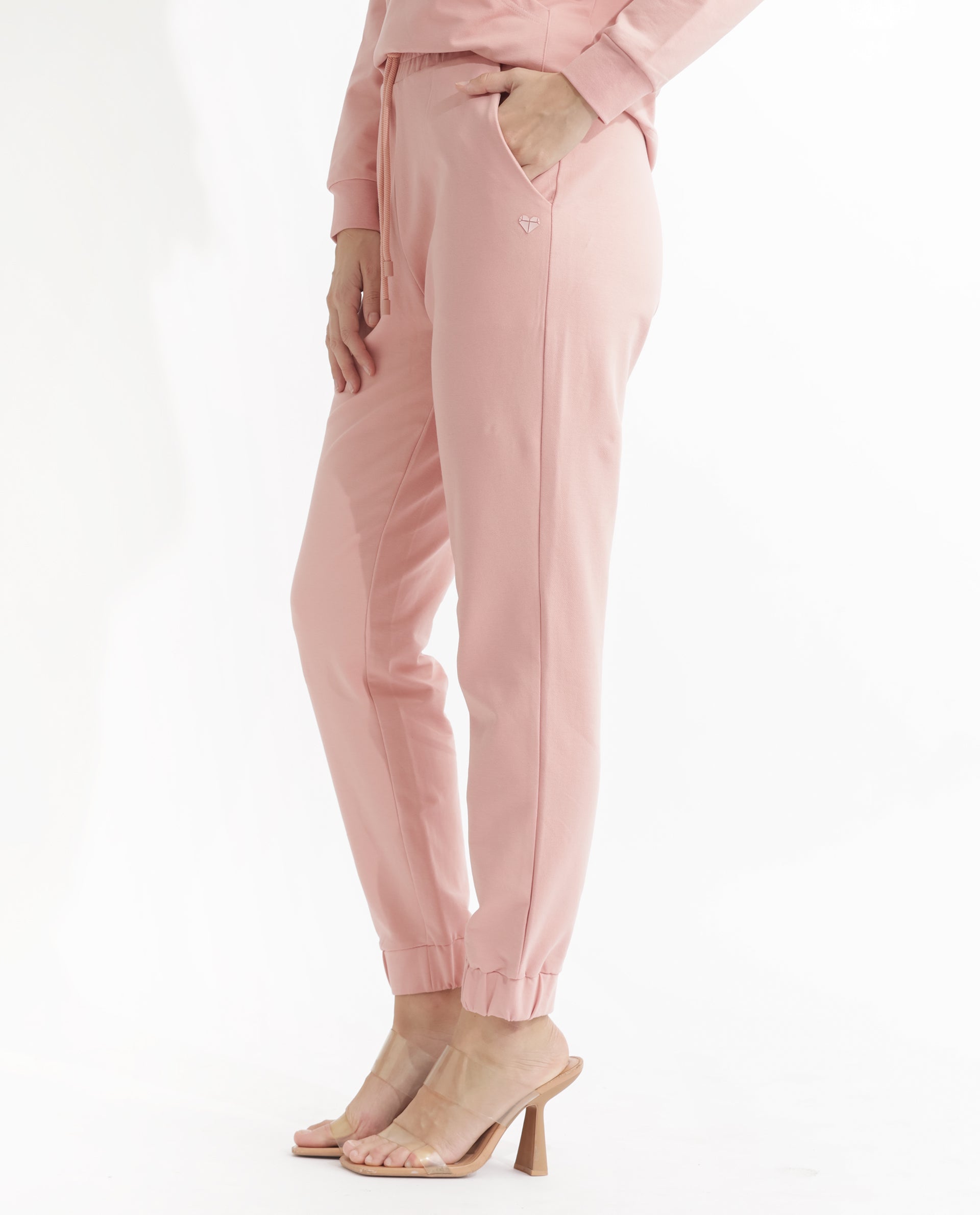 Rareism Women Terac Light Orange Cotton Lycra Fabric Regular Fit Solid Mid Rise Ankle Length Track Pant