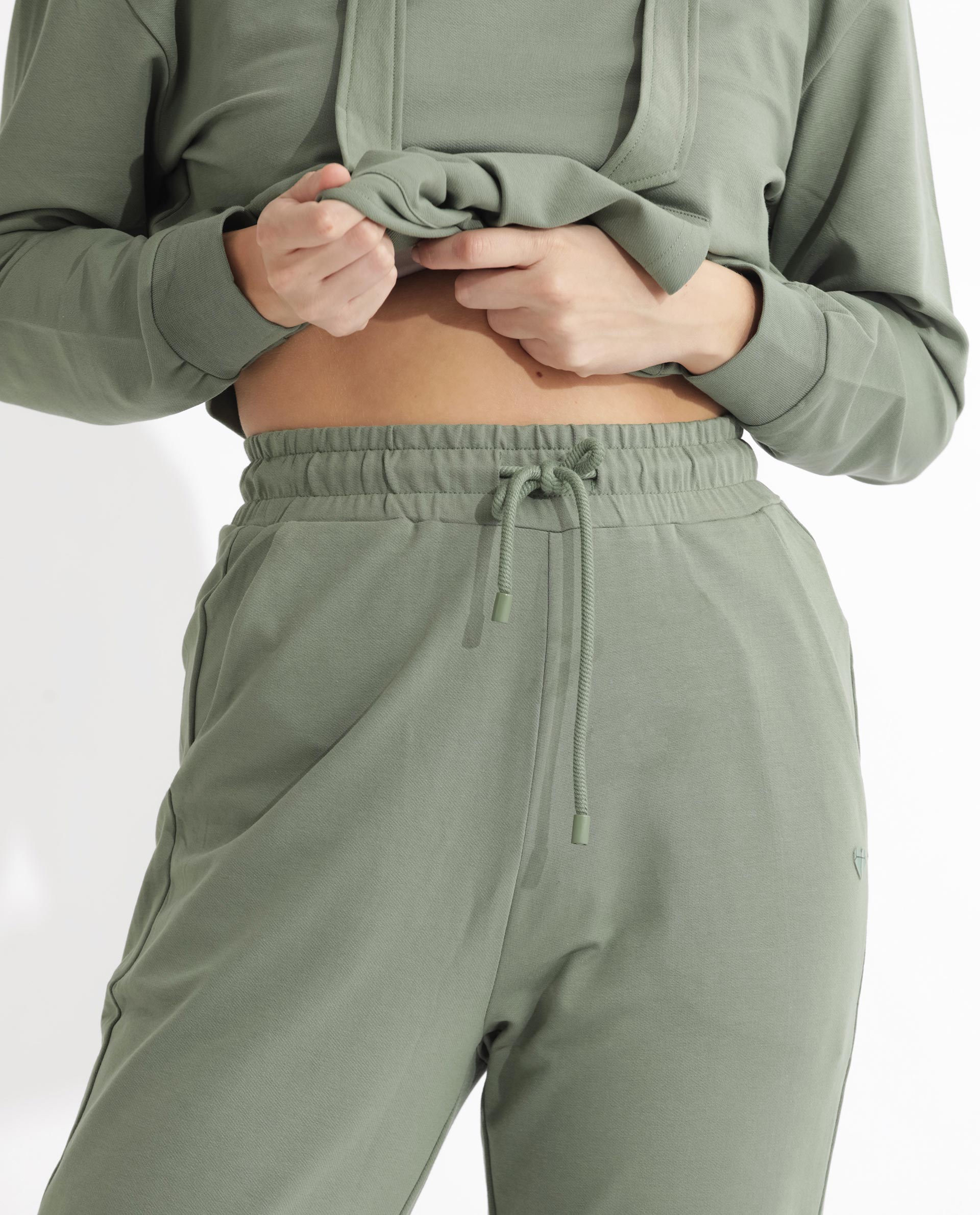 Rareism Women Terac Dusky Green Cotton Lycra Fabric Regular Fit Solid Mid Rise Ankle Length Track Pant