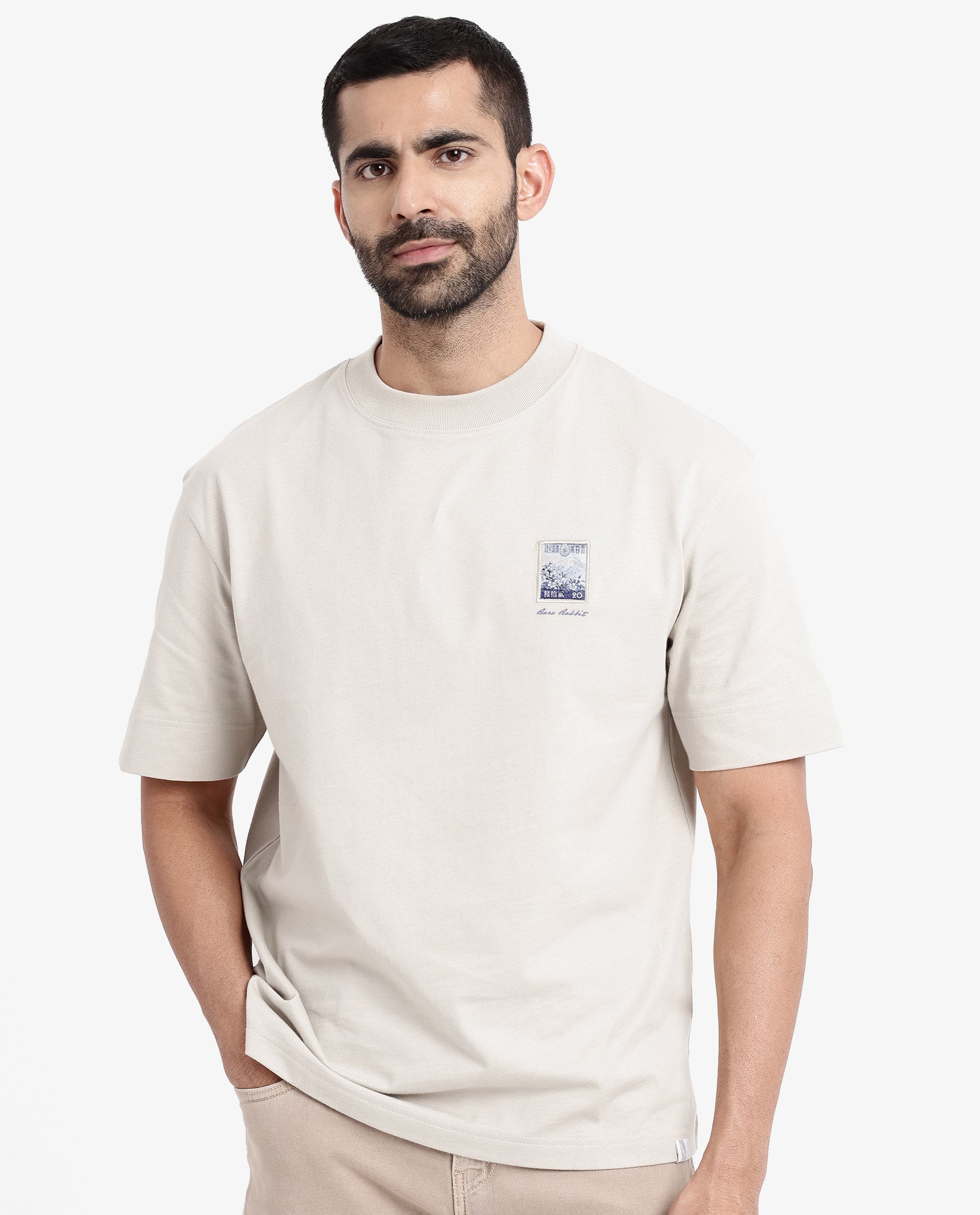 Rare Rabbit Men Trams Beige Cotton Fabric Short Sleeve Crew Neck Oversized Fit Graphic Print T-Shirt