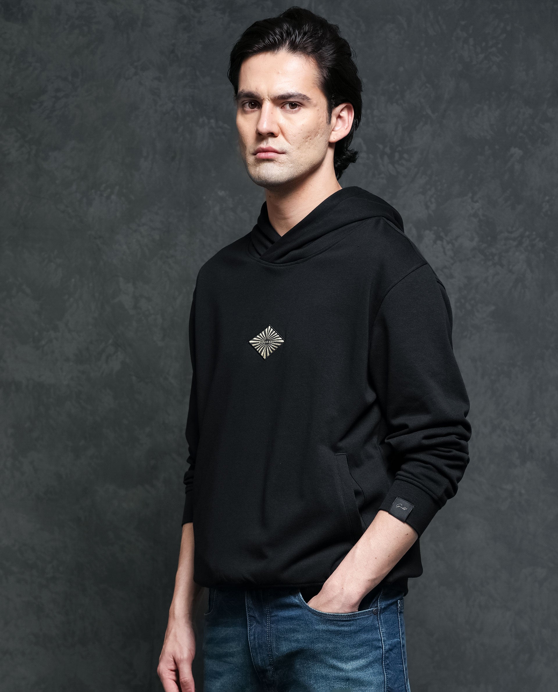 Rare Rabbit Men's Trivial Black Cotton Polyester Fabric Full Sleeves Logo Graphic Badge Hooded Sweatshirt