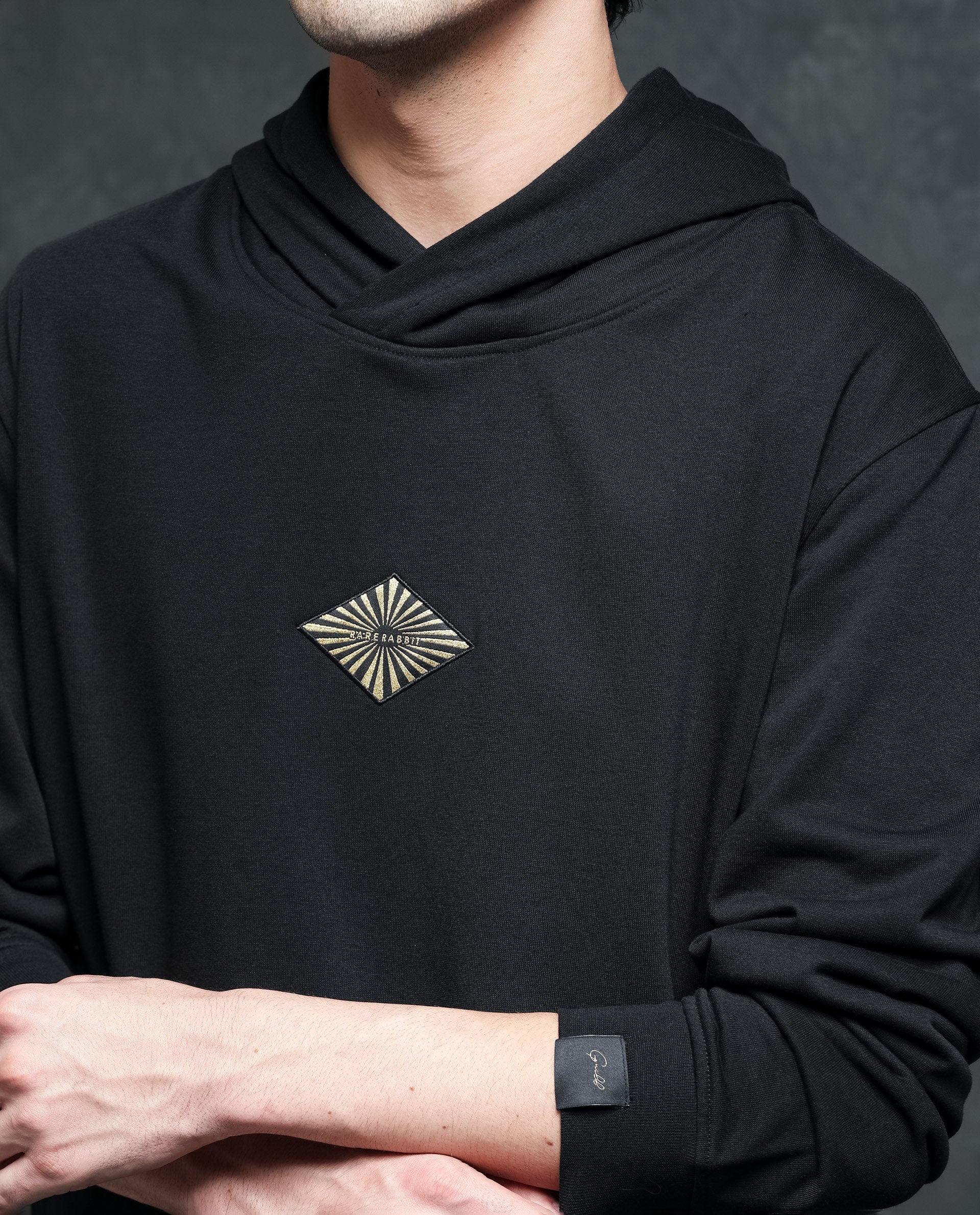 Rare Rabbit Men's Trivial Black Cotton Polyester Fabric Full Sleeves Logo Graphic Badge Hooded Sweatshirt