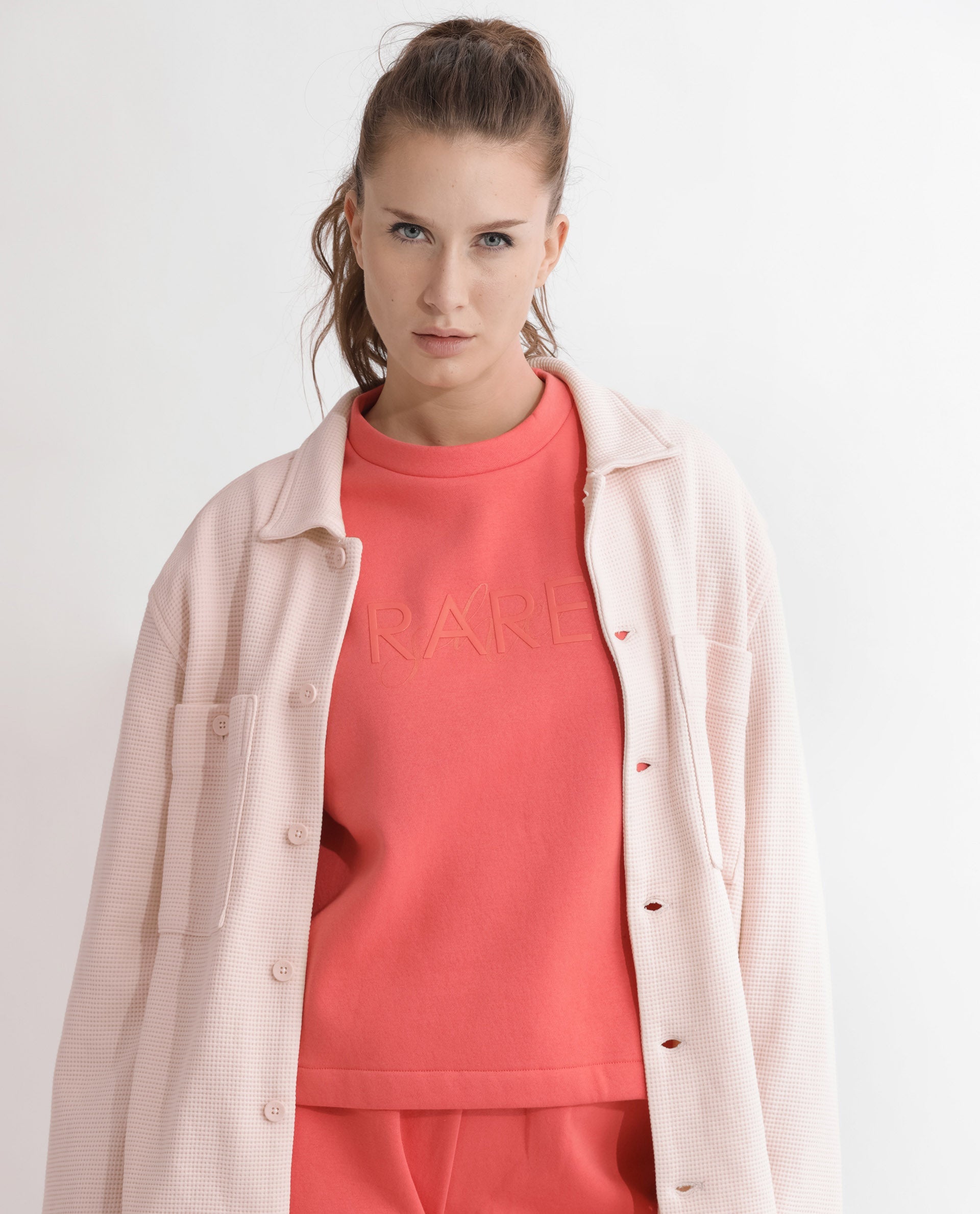 Rareism Articale Women Tupino Orange Poly Cotton Fabric Full Sleeves Cuffed Sleeve Round Neck Relaxed Fit Plain Sweatshirt