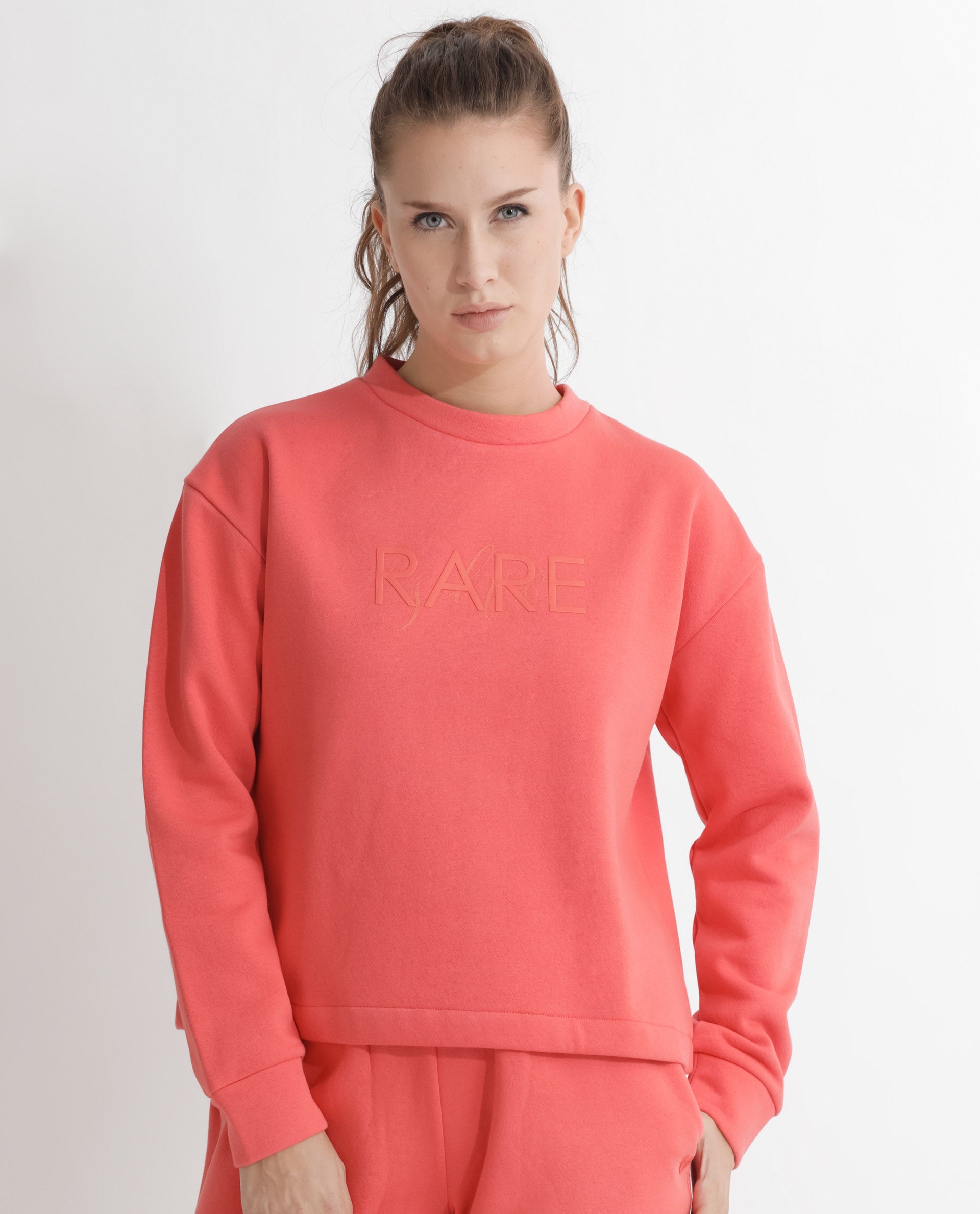 Rareism Articale Women Tupino Orange Poly Cotton Fabric Full Sleeves Cuffed Sleeve Round Neck Relaxed Fit Plain Sweatshirt