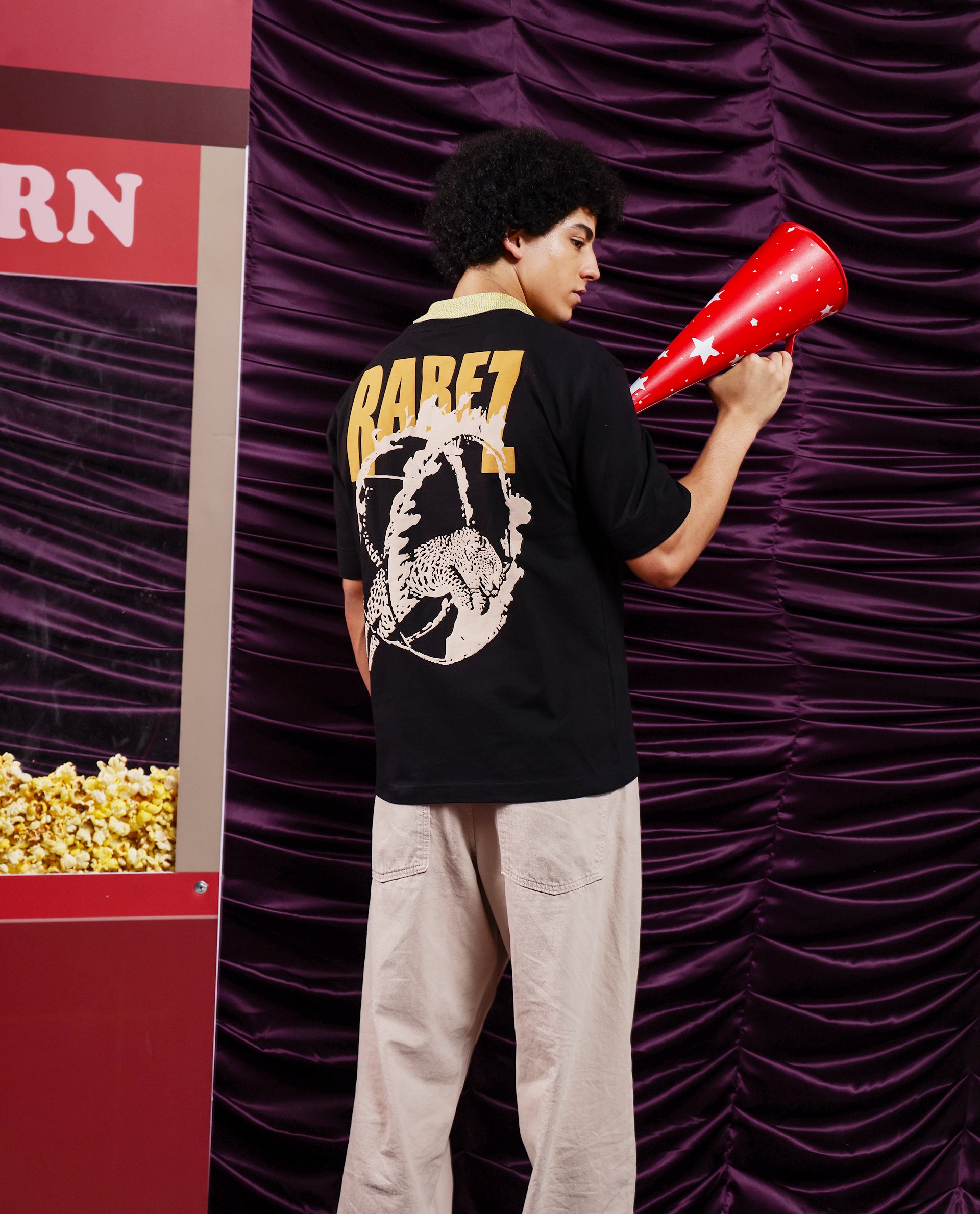 Rare Rabbit Men Tyga Black Cotton Fabric Short Sleeve Crew Neck Oversized Fit Graphic Back Print T-Shirt