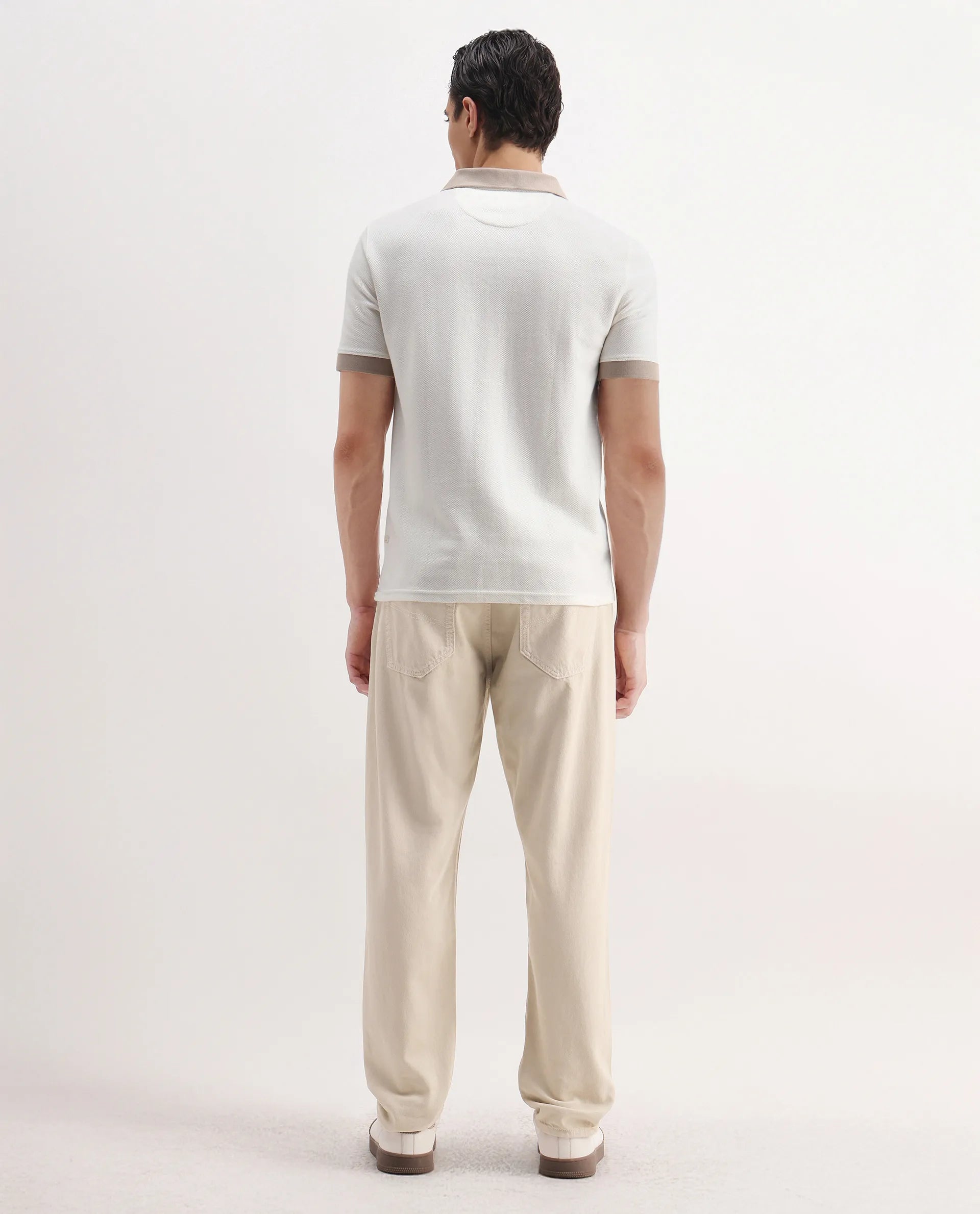 Rare Rabbit Men's Arvi-2 Light Beige Cotton Blend Plain Dond Carrot Fit Jeans