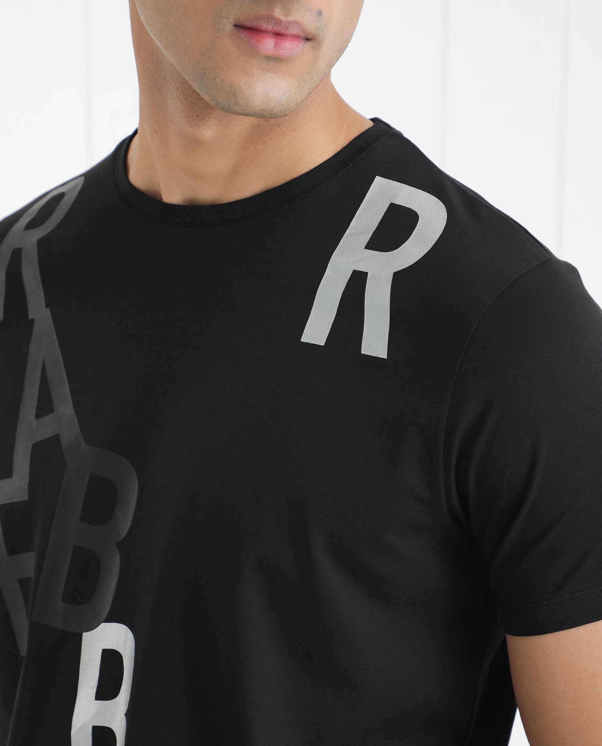 Rare Rabbit Men's Heras Black Crew Neck Foil and Plastisol Overall Branding Half Sleeves Regular Fit T-Shirt
