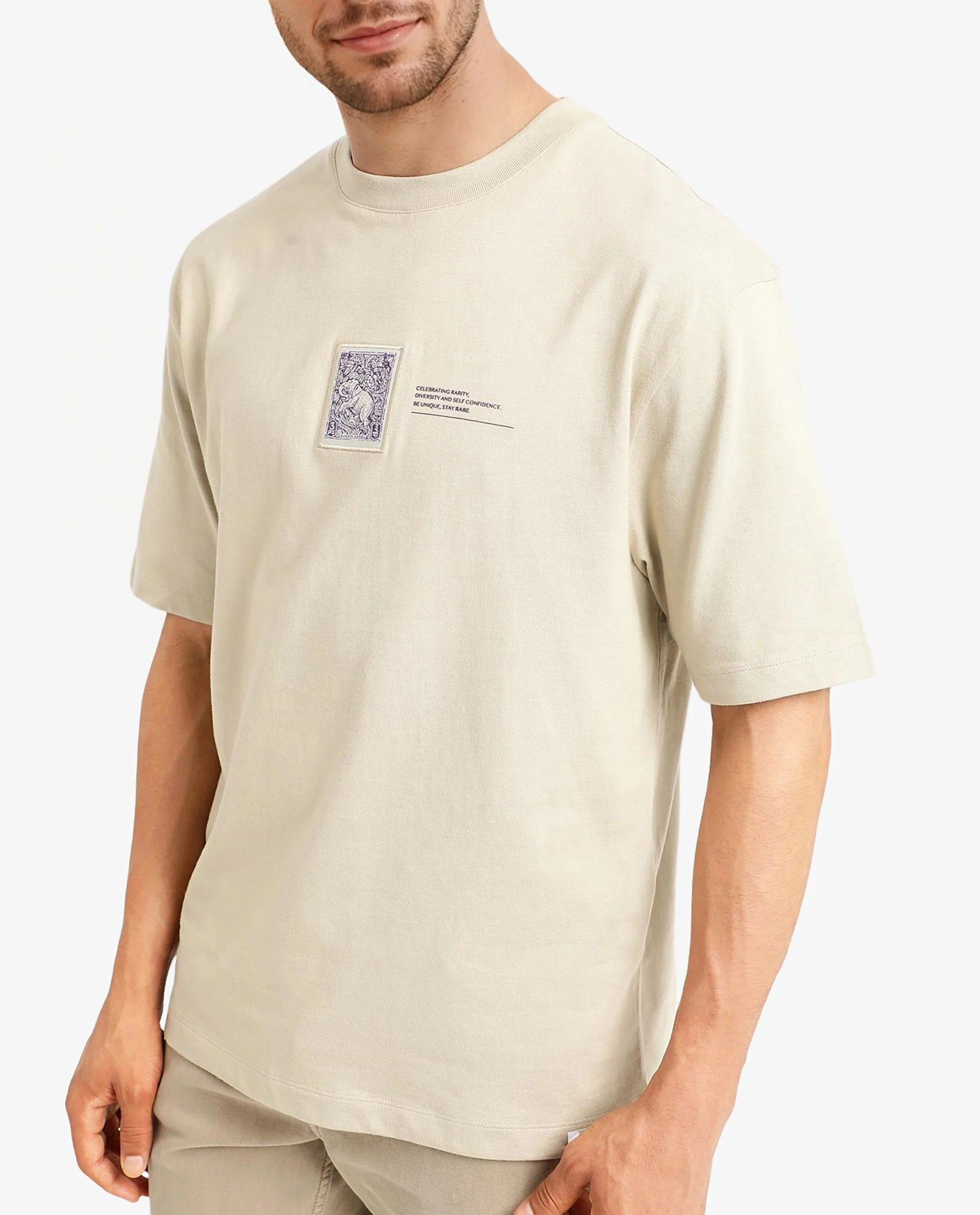 Rare Rabbit Men Iylo Beige Cotton Fabric Short Sleeve Crew Neck Oversized Fit Graphic Print T-Shirt