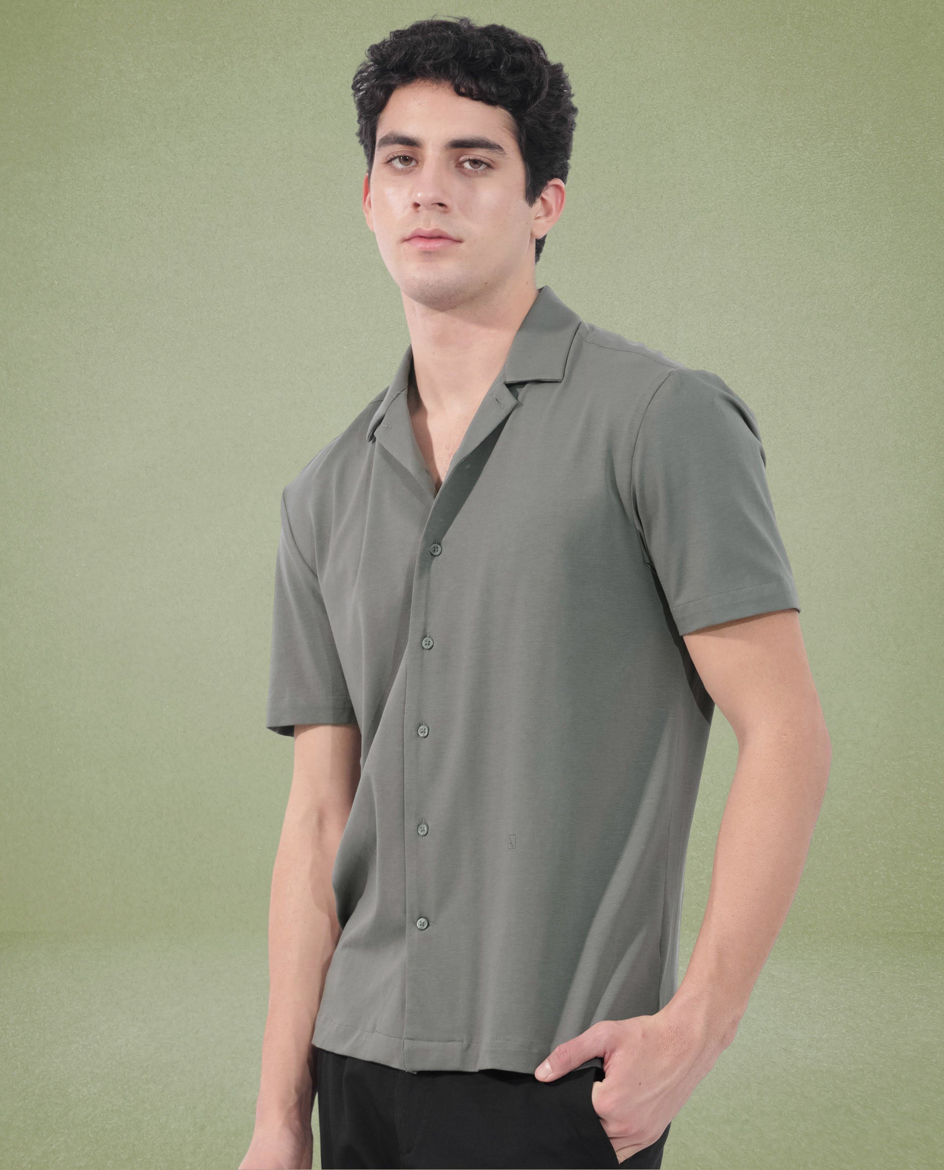 Rare Rabbit Men's Nick Dark Green Cotton Lycra Fabric Cuban Collar Half Sleeves Solid Shirt