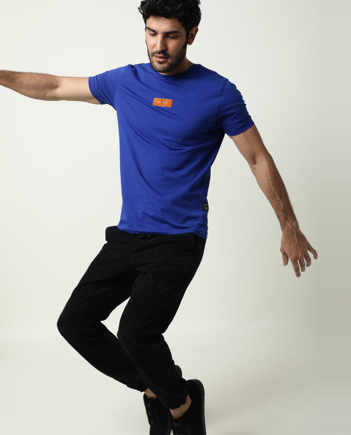 Rare Rabbit Men's Trix Fluorescent Blue Cotton Fabric Crew Neck Half Sleeves Slim Fit Velvet Badge Solid T-Shirt