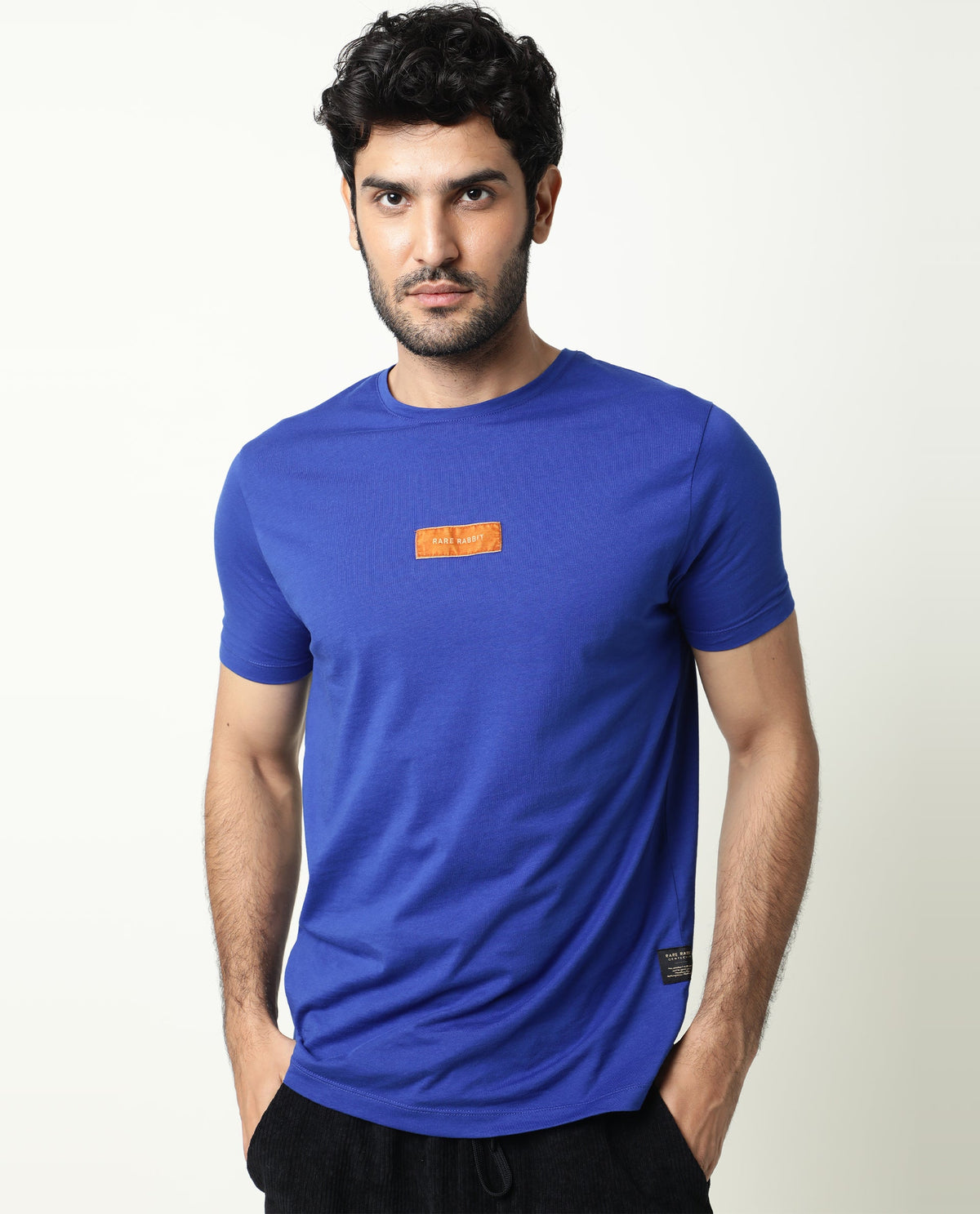 Rare Rabbit Men's Trix Fluorescent Blue Cotton Fabric Crew Neck Half Sleeves Slim Fit Velvet Badge Solid T-Shirt