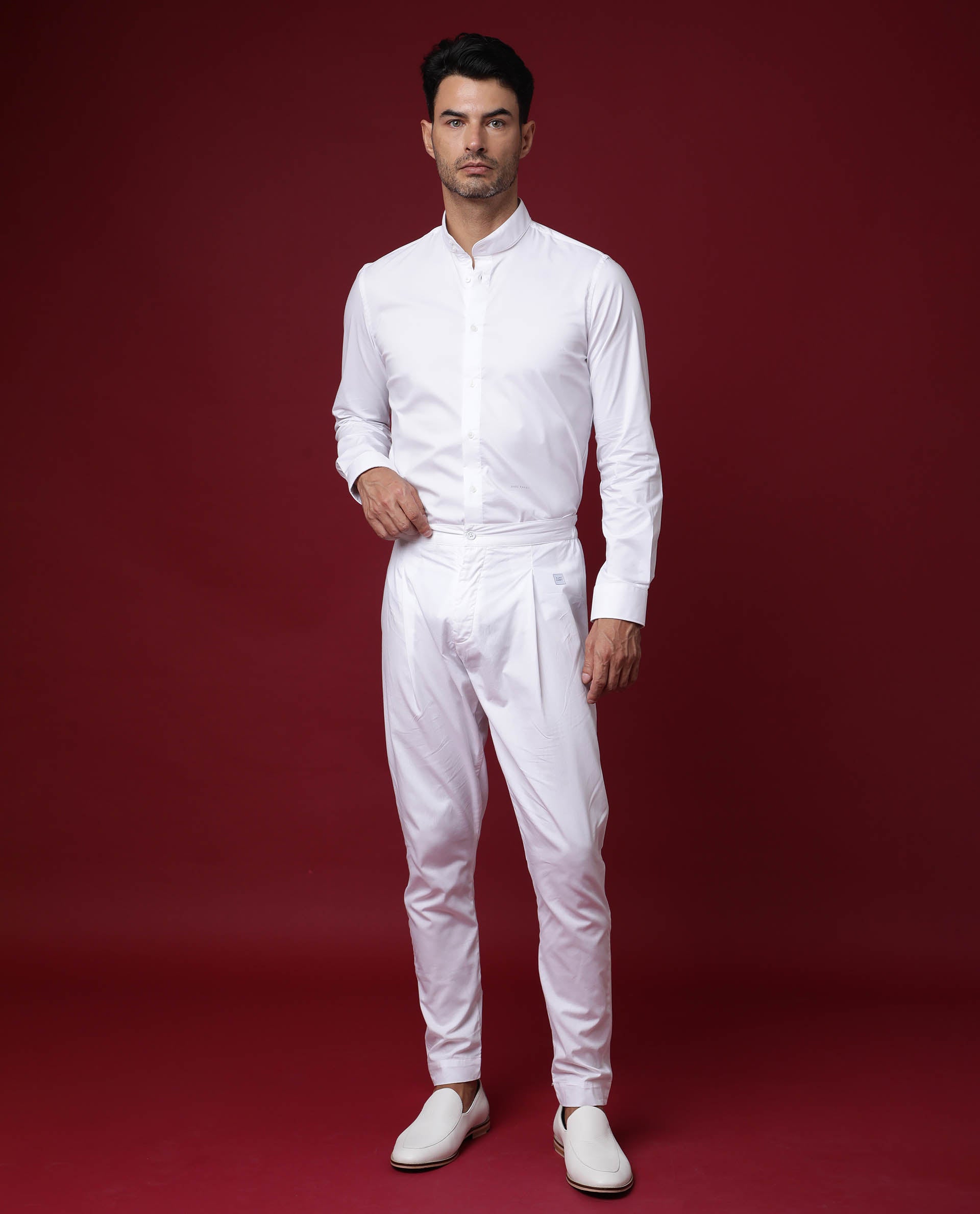 Man in white crew neck tshirt and white pants standing near brown wall  photo  Free White outfit Image on Unsplash