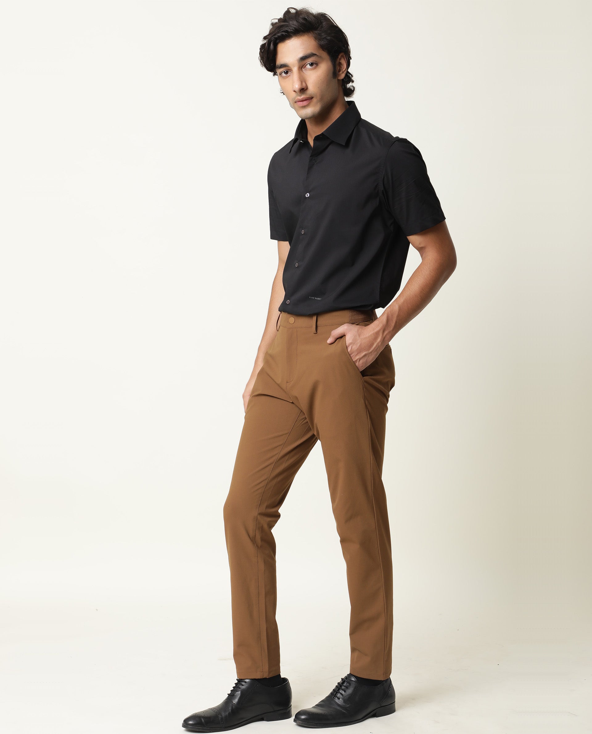 29010 Black Shirt Brown Pants Stock Photos HighRes Pictures and Images   Getty Images