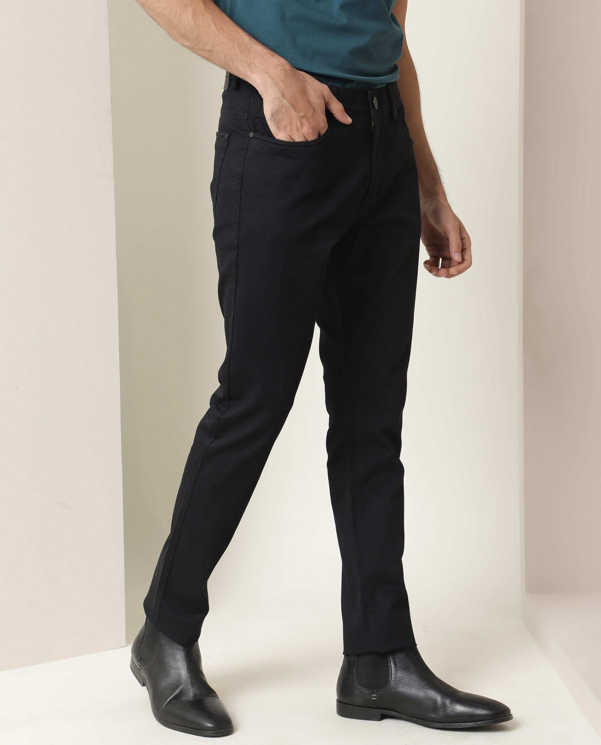 Rare Rabbit Men's Poke Black Solid Mid-Rise Regular Fit Trouser
